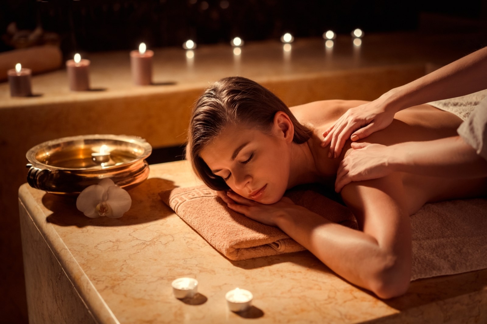 Young girl in spa massage
