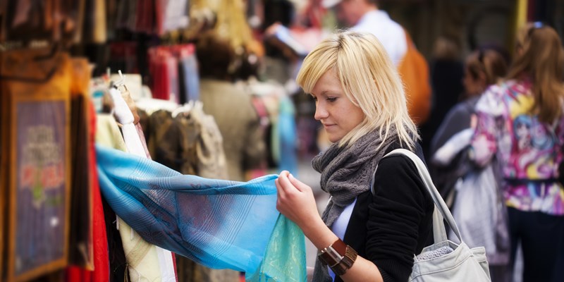 Young blond girl shopping some muslim goods.