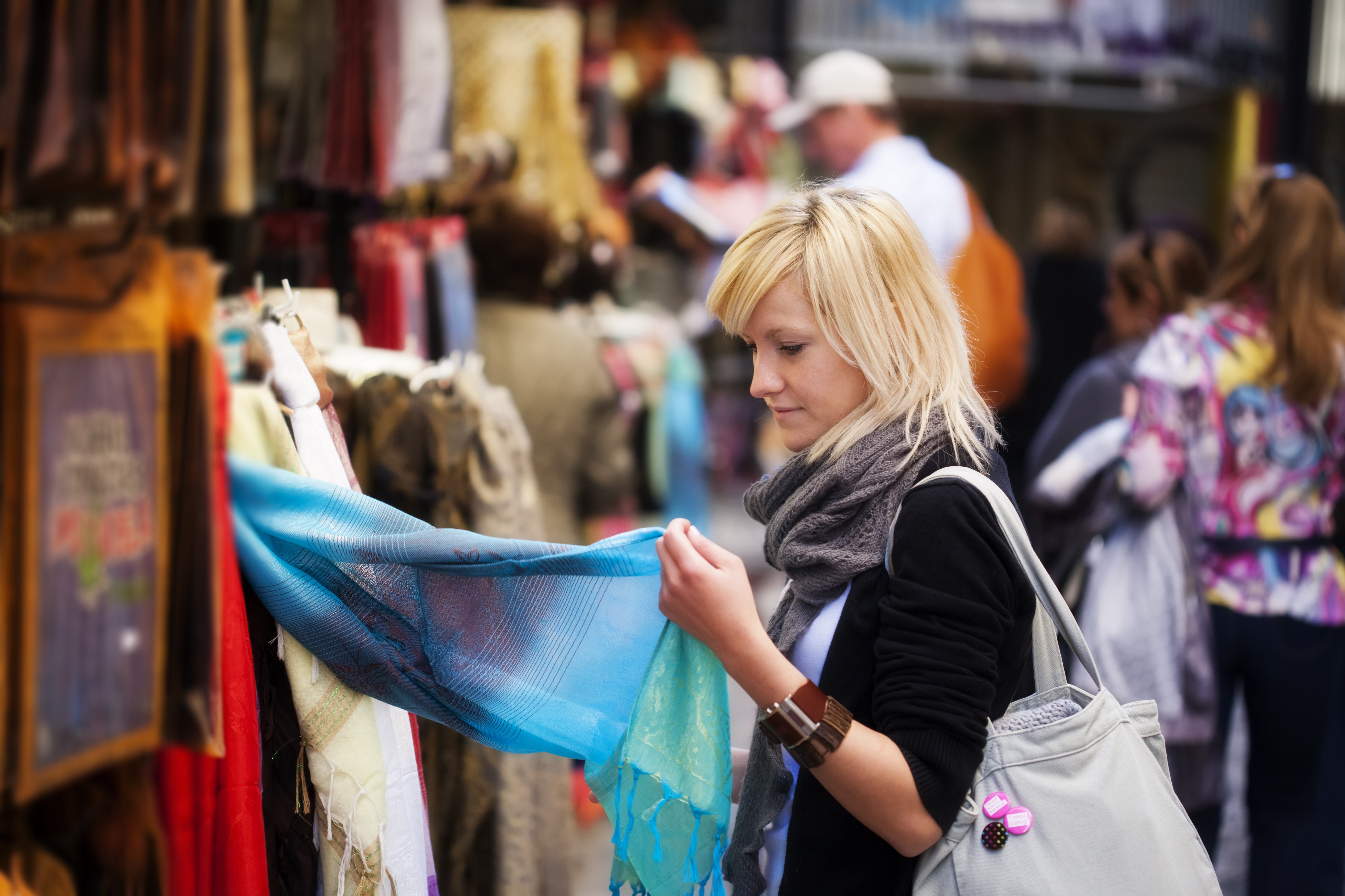 Young blond girl shopping some muslim goods.