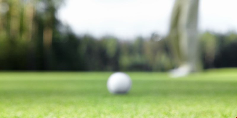 A man playing golf
