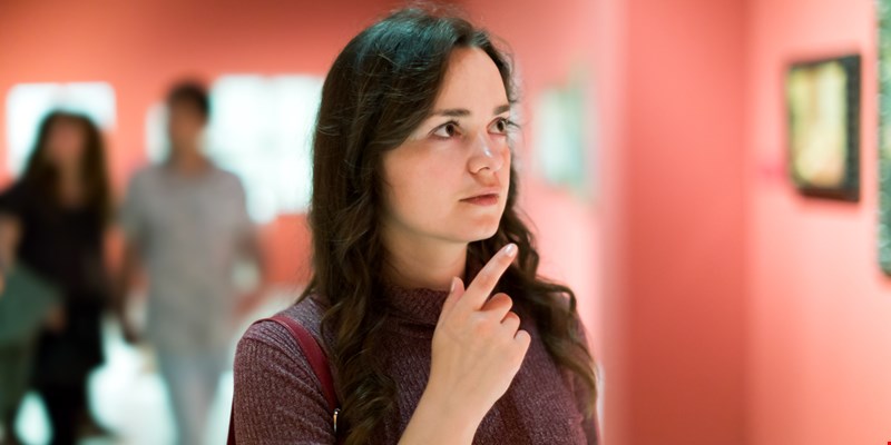 Girl looking at art