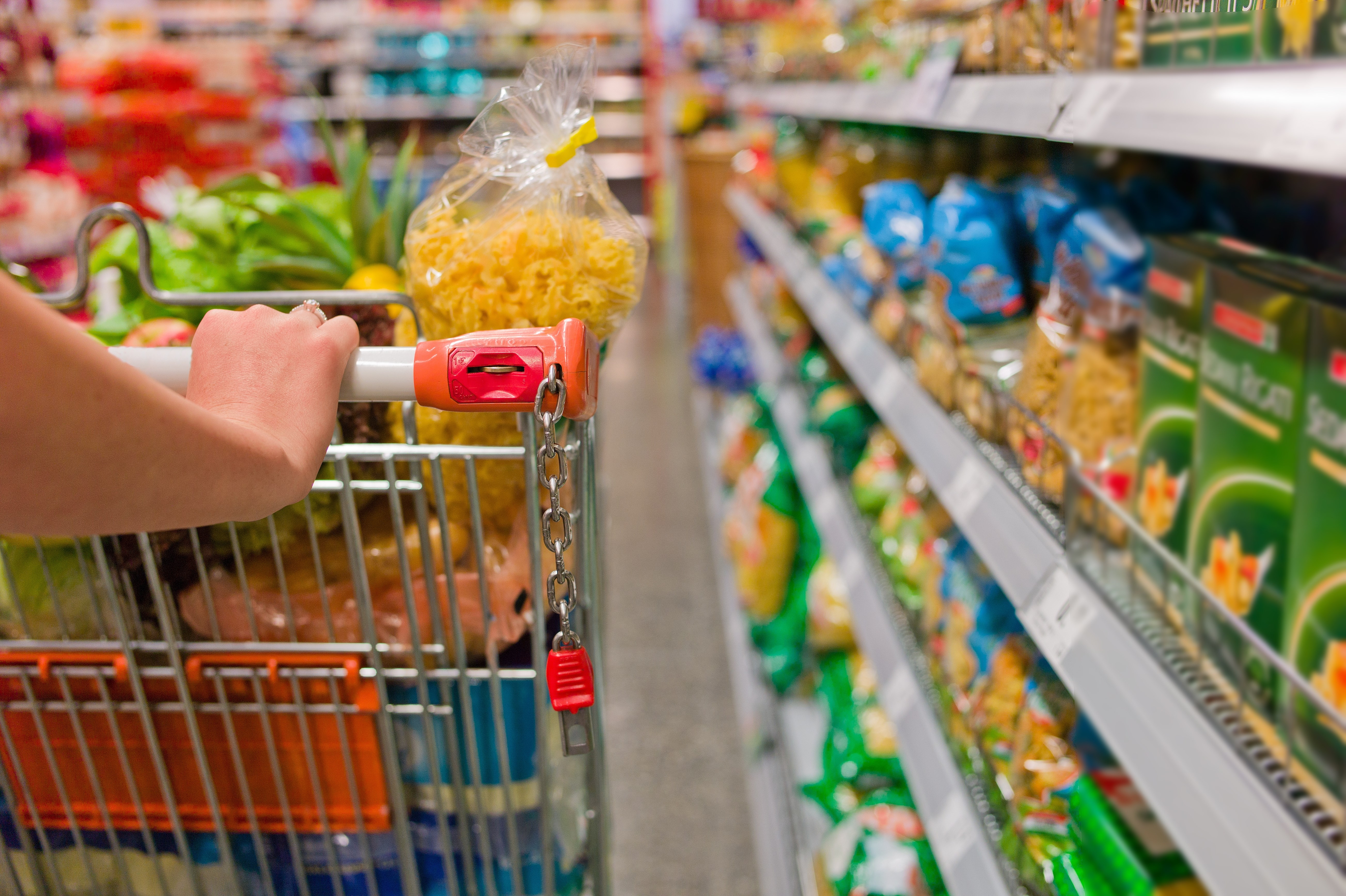 a woman in the purchase of food in a supermarket. everyday life of a housewife