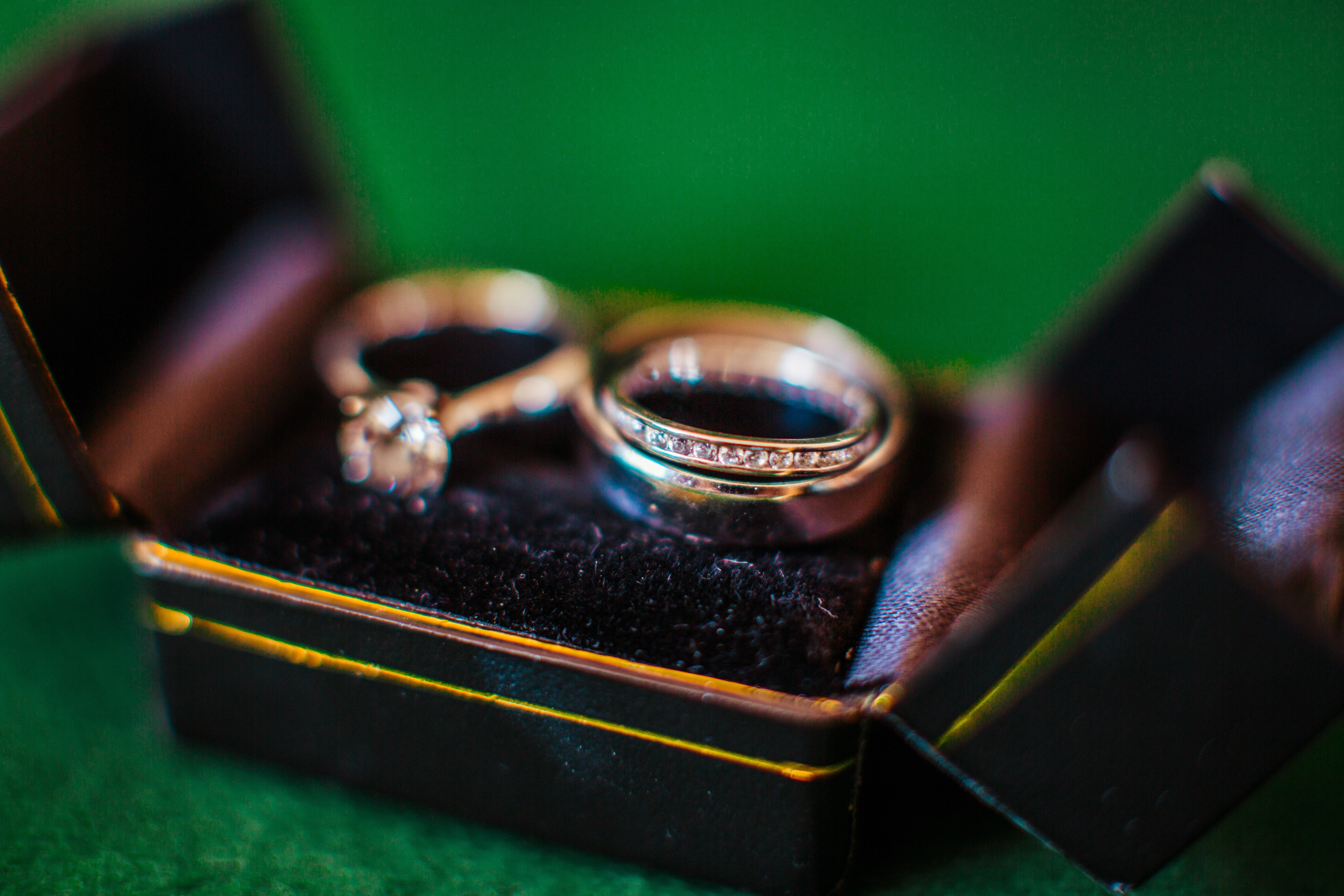 The wedding rings standing on the box