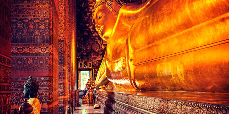 Vintage retro effect filtered hipster style image of reclining Buddha gold statue. Wat Pho, Bangkok, Thailand