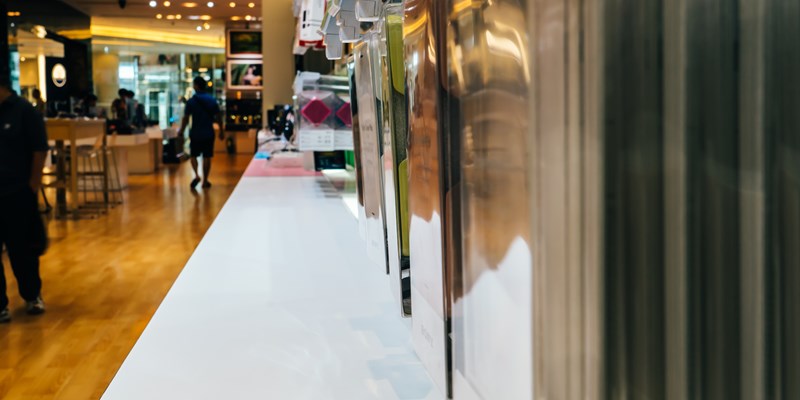 designer shop in an upscale shopping mall, purses and shoes on display