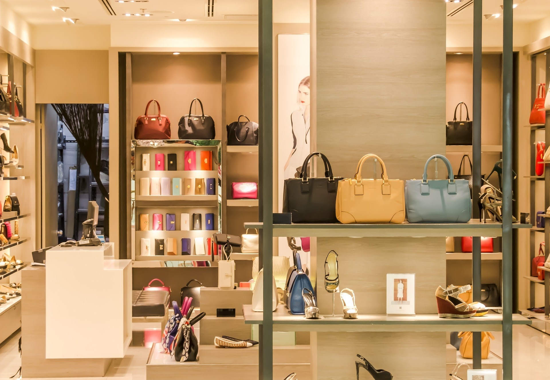 designer shop in an upscale shopping mall, purses and shoes on display
