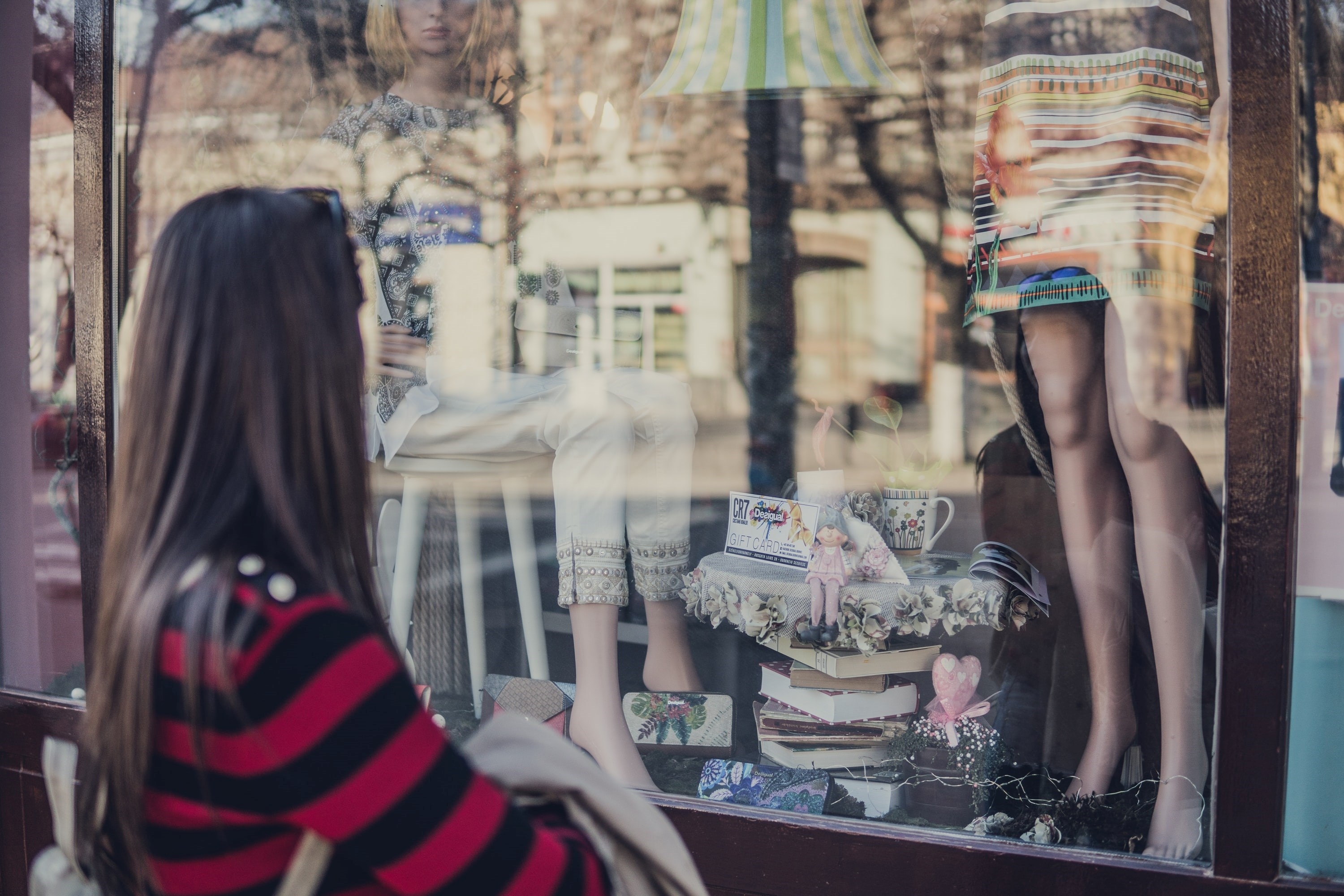 Woman staring at a shopping window at Avinguda del Portal de l'Àngel, Barcelona