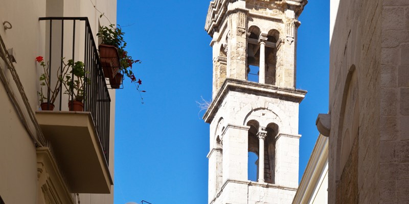 Italy. The narrow streets of the old town of Bari. The bell tower of the church of St. Giacomo
