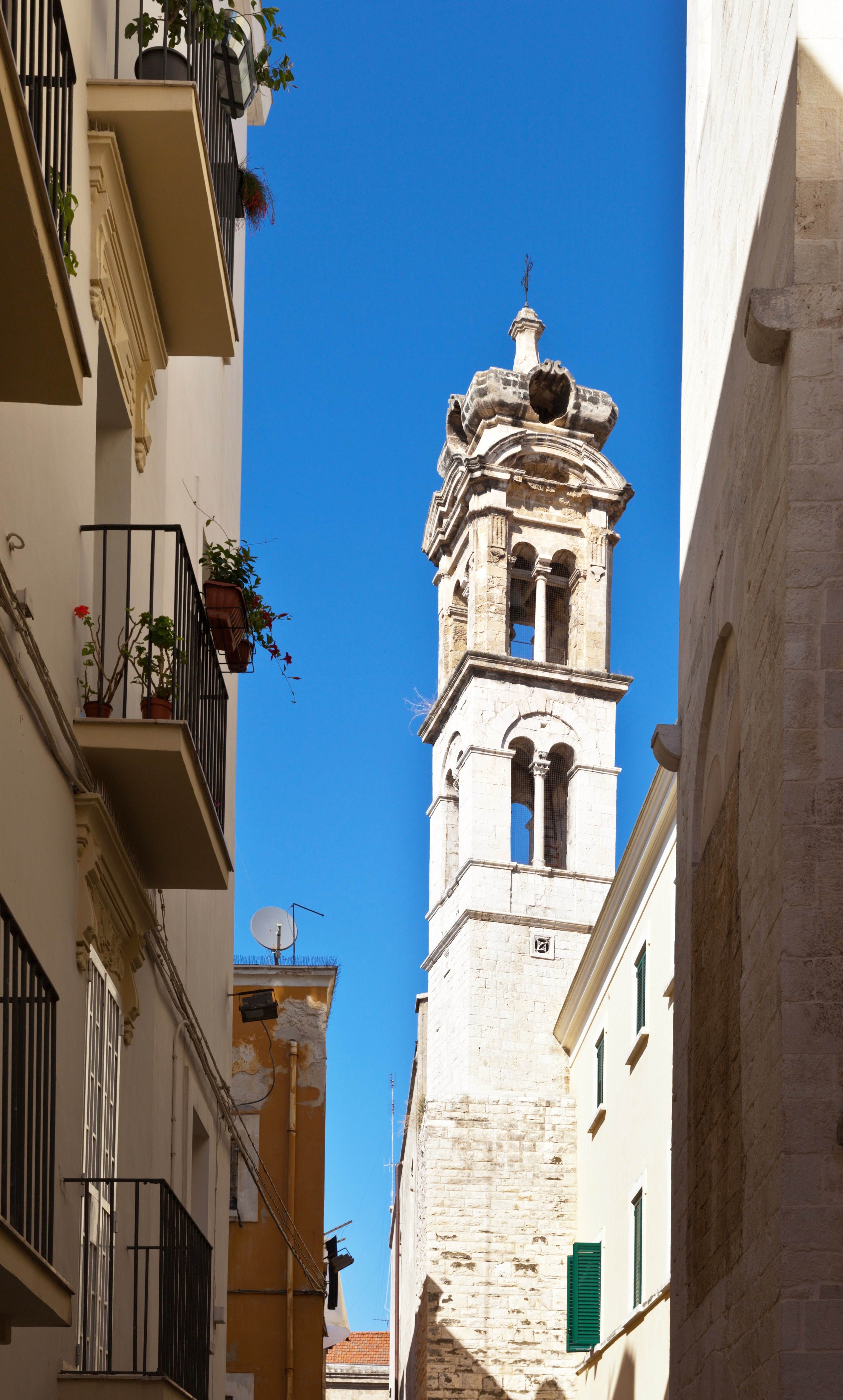 Italy. The narrow streets of the old town of Bari. The bell tower of the church of St. Giacomo