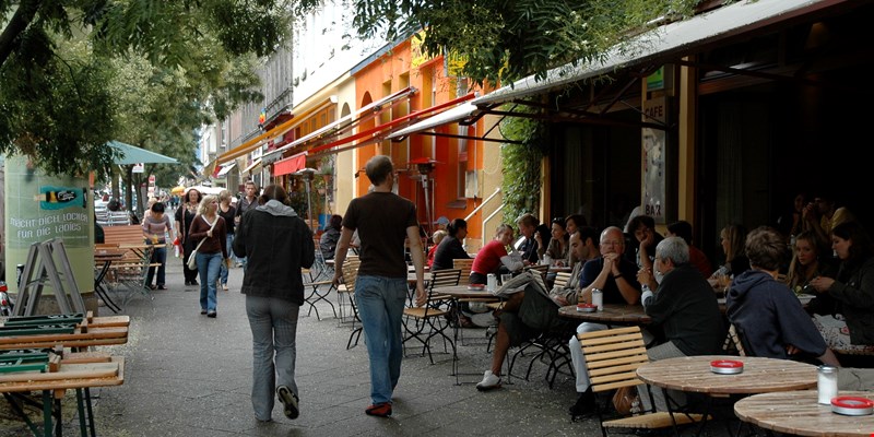 people sitting outside a cafe on Bergmannstr., Kreuzberg, Berlin, Germany