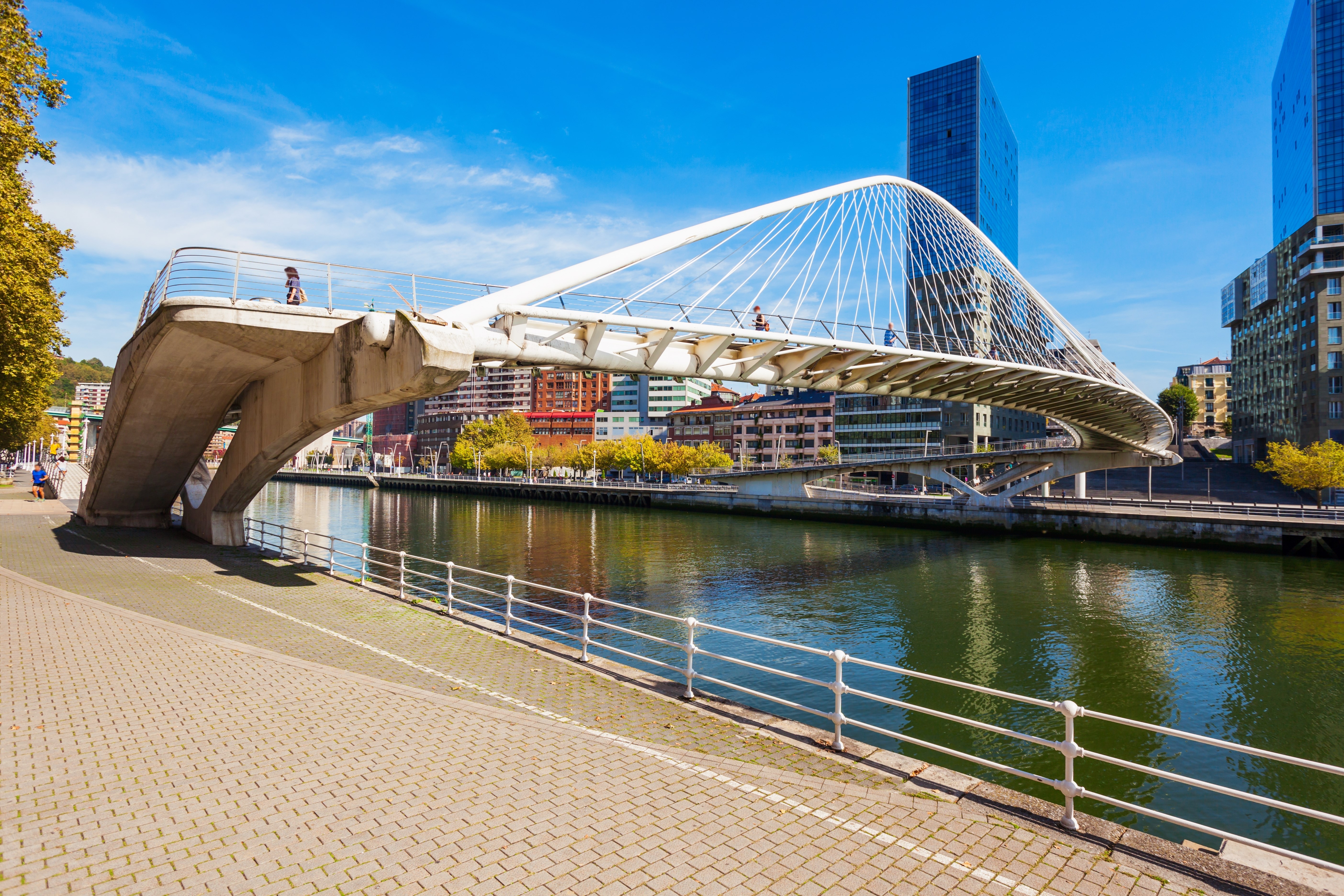 Zubizuri Bridge, Nervion River embankment in the centre of Bilbao, largest city in the Basque Country in northern Spain