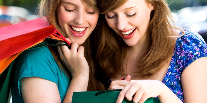 Women looking in shopping bags
