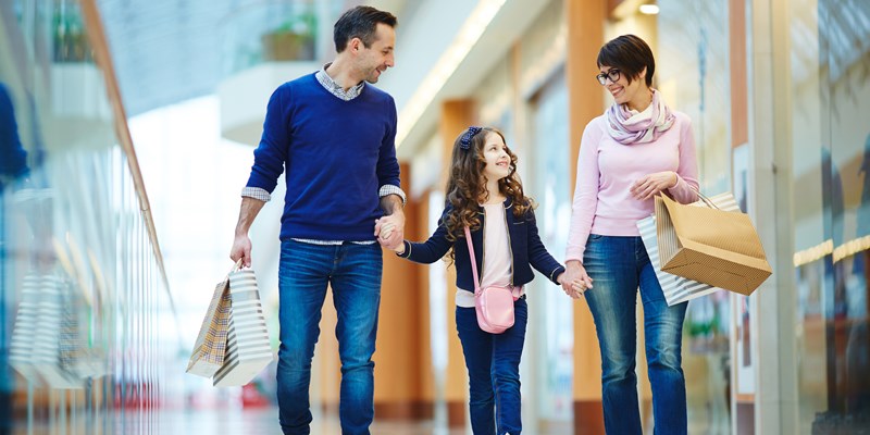 family happy in shopping mall