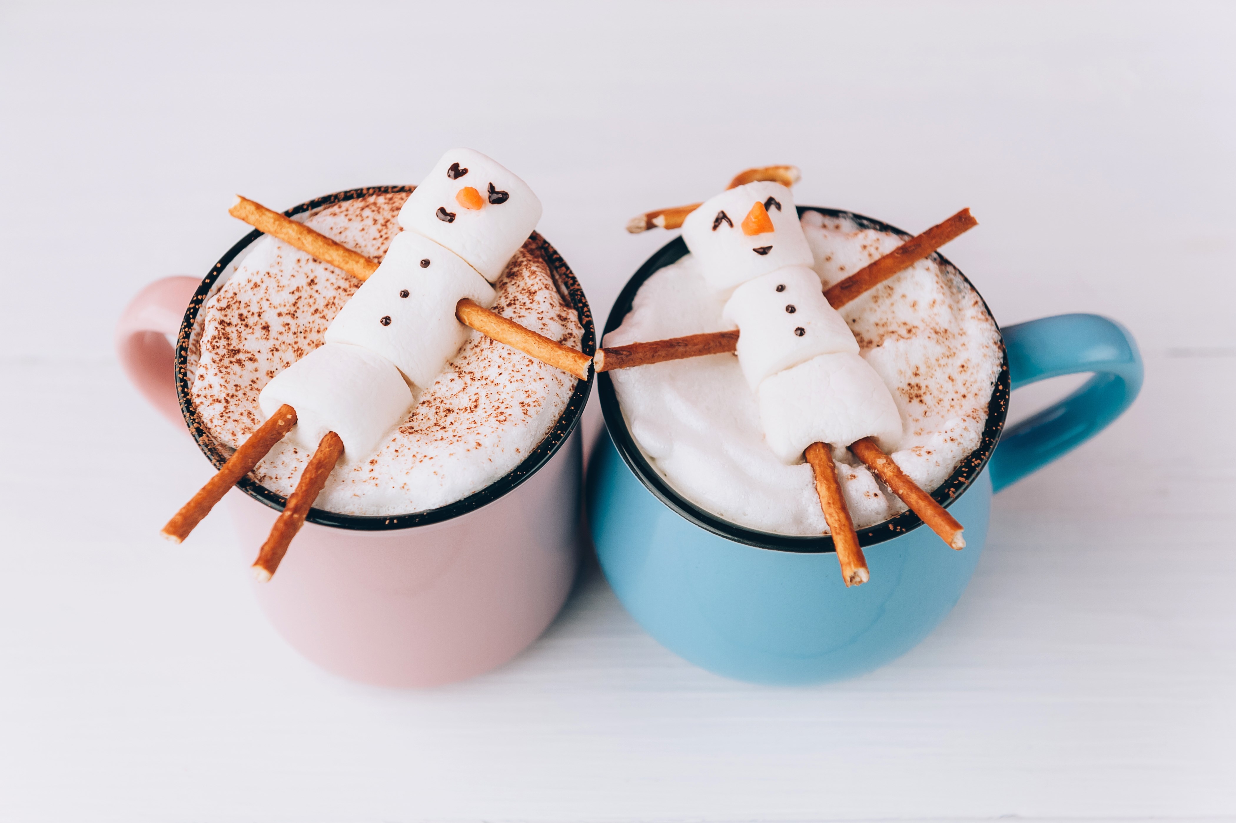 mugs with hot chocolate in which the men from the marshmallow relax. concept of a couple