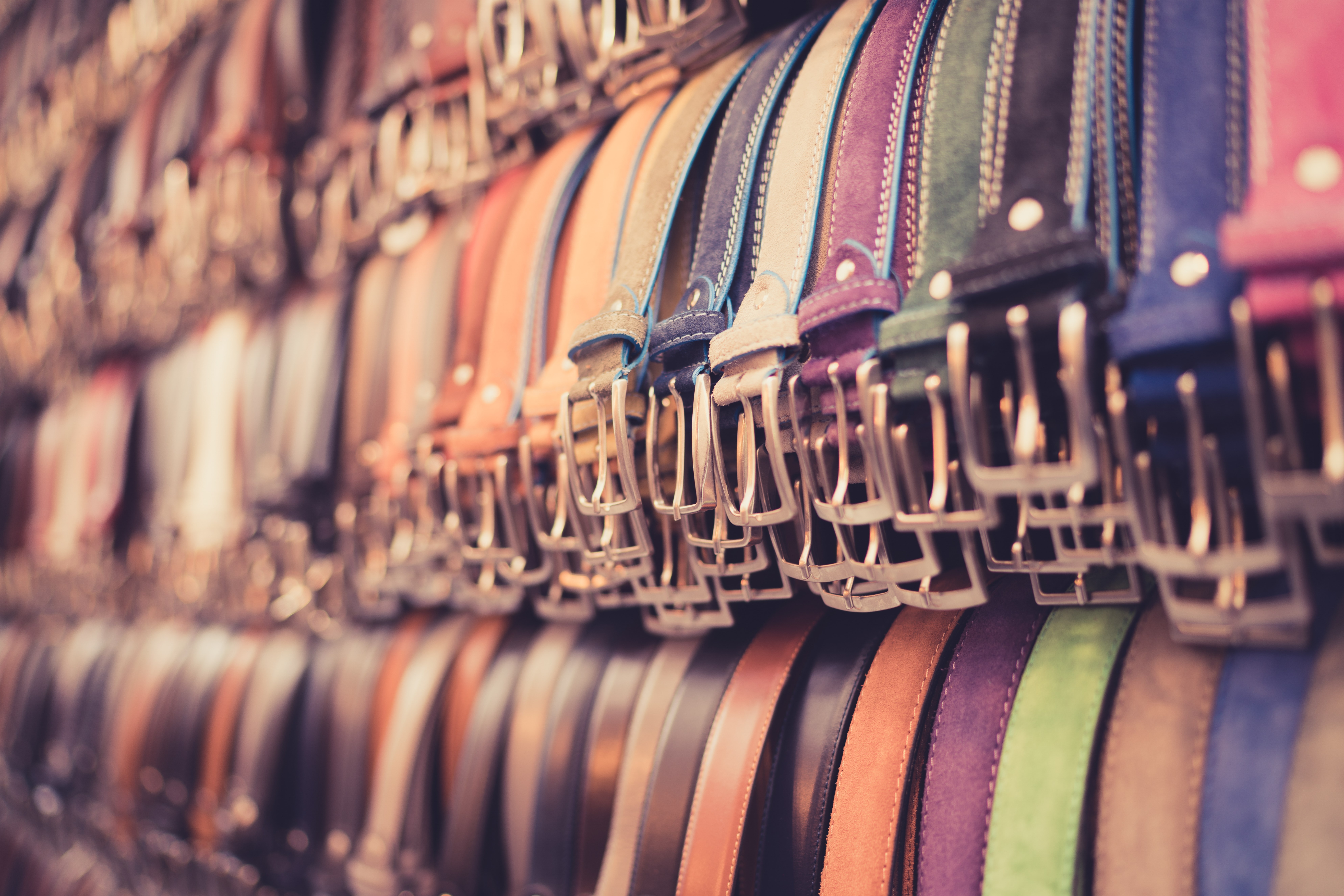 A number of belts in a Florence market.
