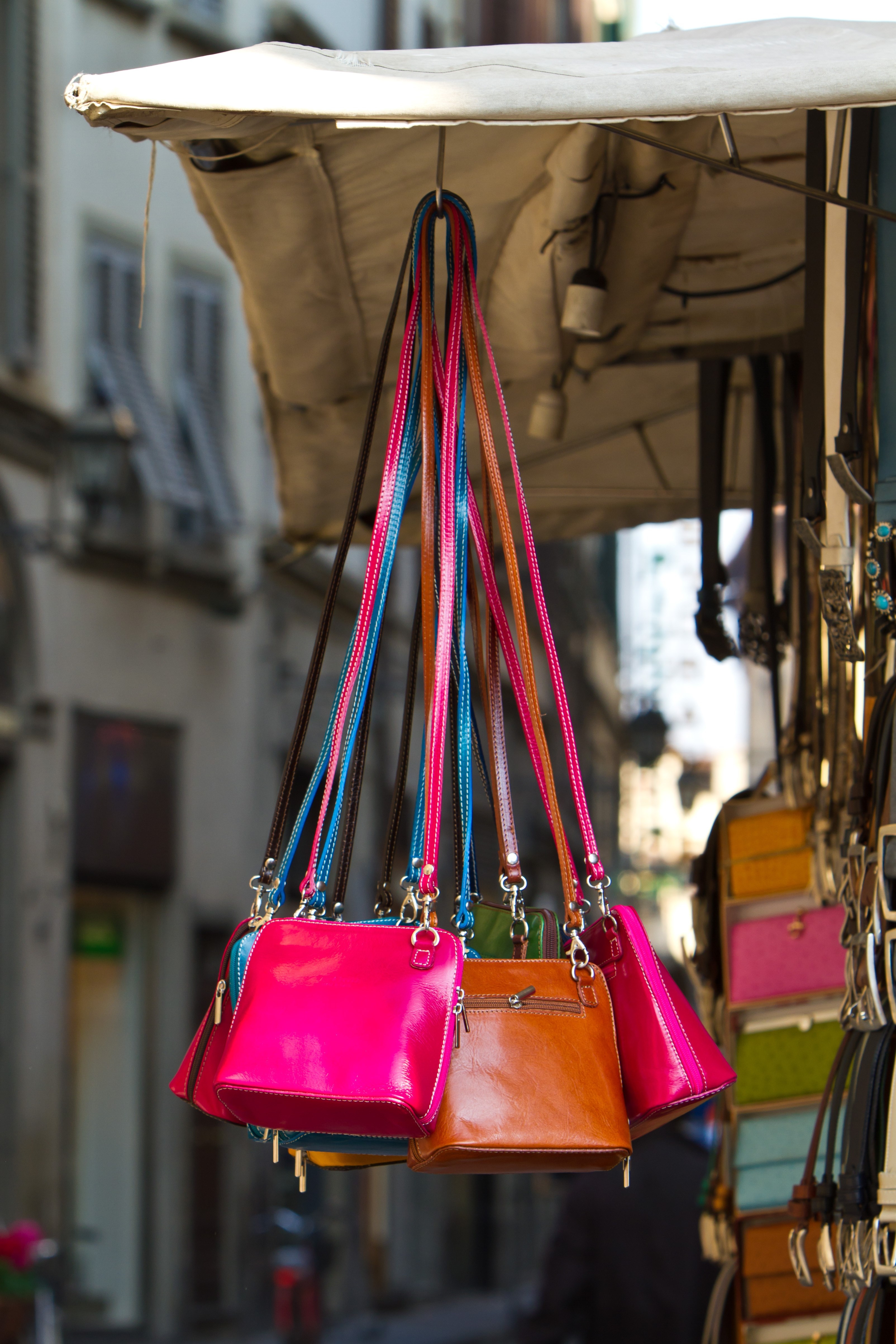 Leather purses for sale on a street vendors cart in Florence, Italy