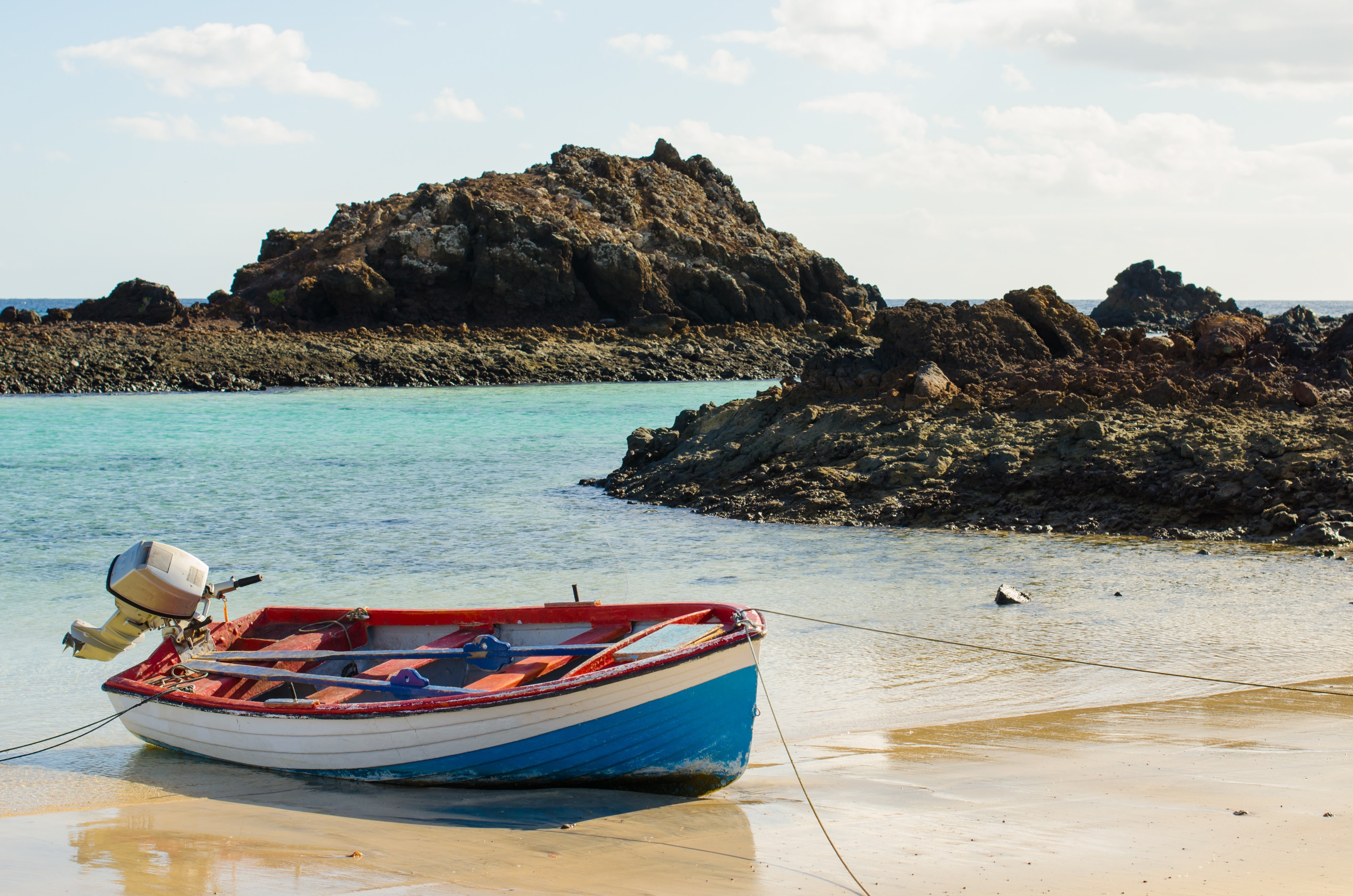 Boat on the edge of the beach, on the Island of Lobos