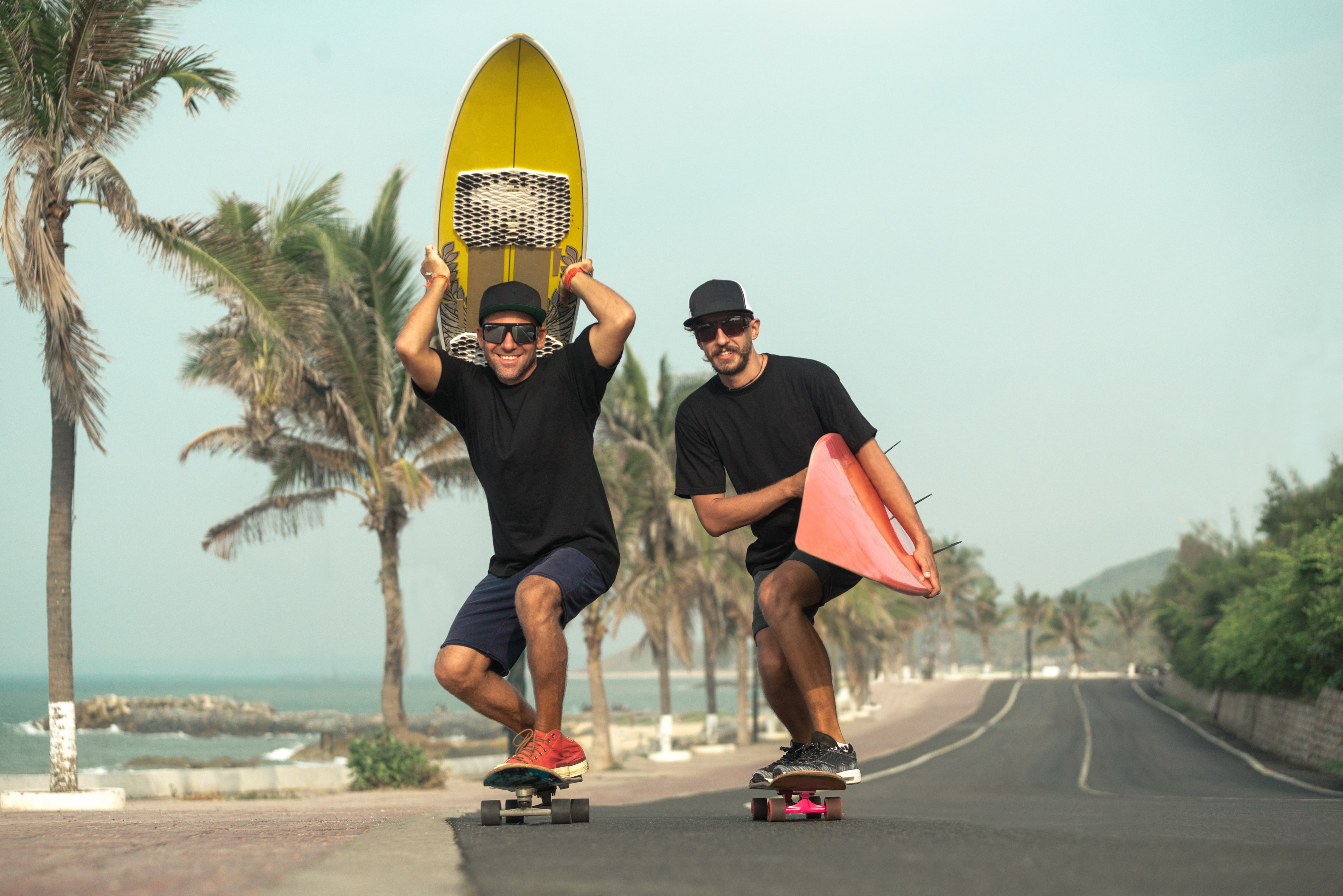 Surfers having fun with surfboards