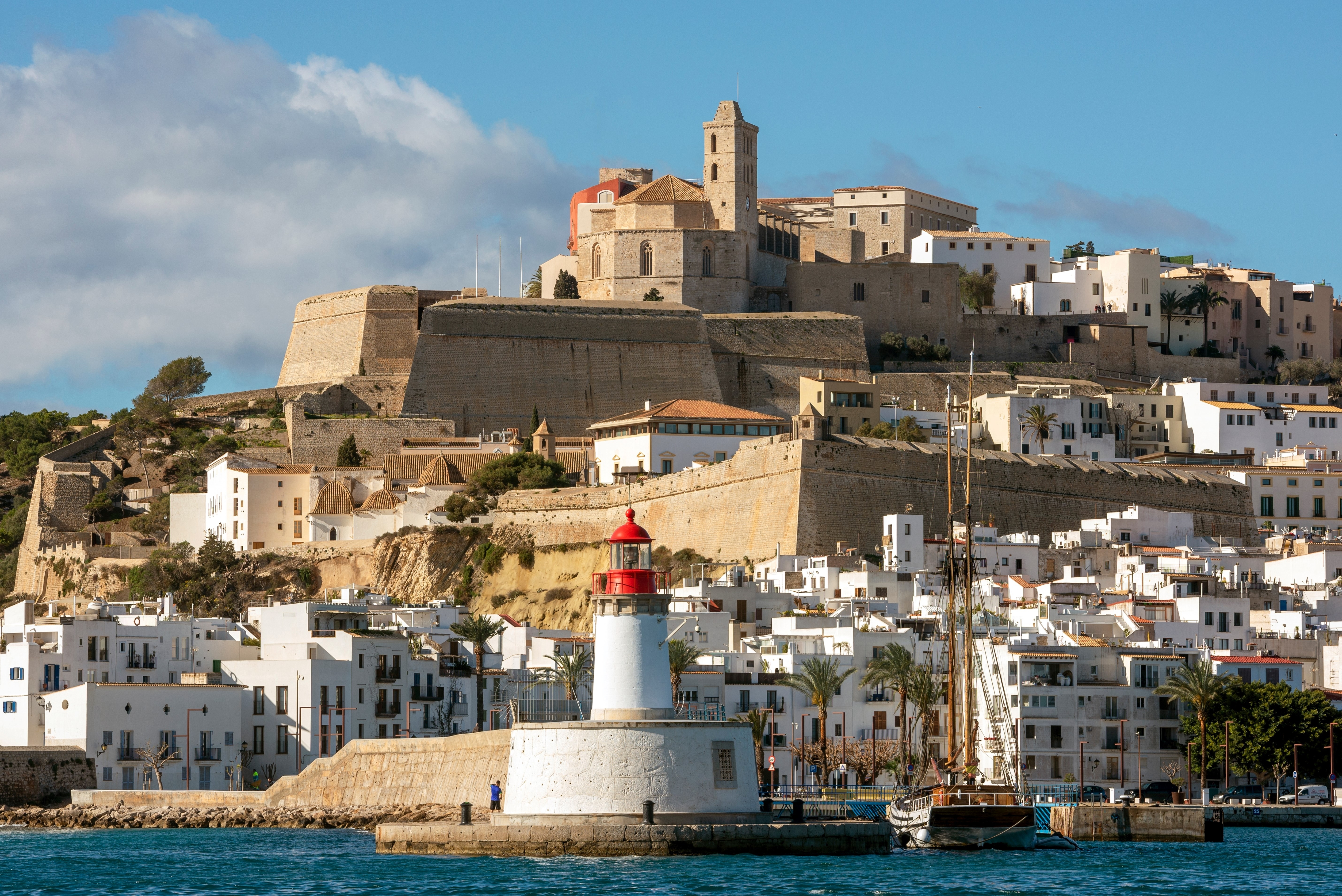 View of Ibiza old town with Santa Maria cathedral on top of the hill and the port lighthouse, Ibiza Island, Balearic Islands, Spain