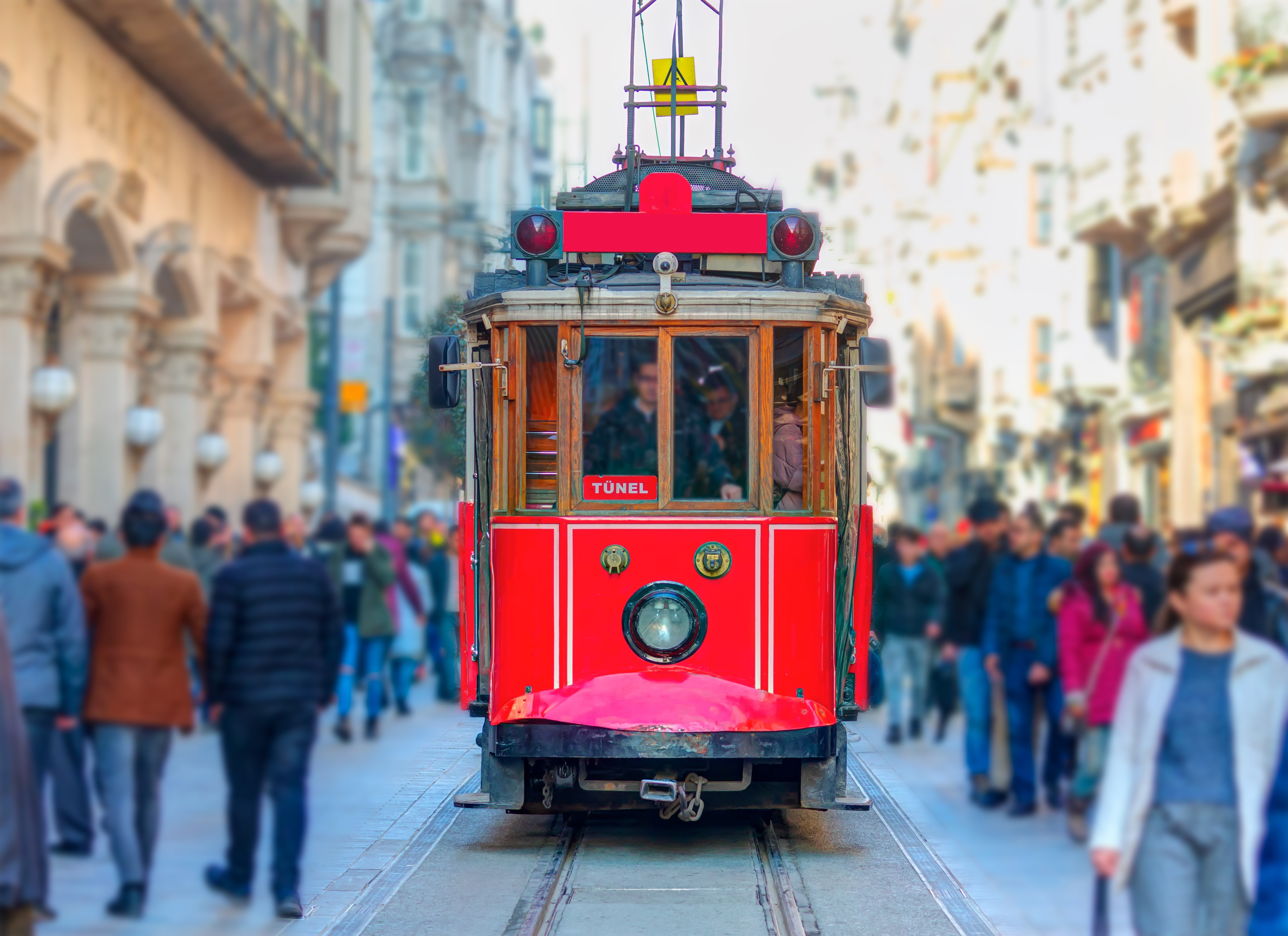 Nostalgic retro red tram on famous Istiklal street. Istiklal Street is a popular tourist destination in Istanbul.