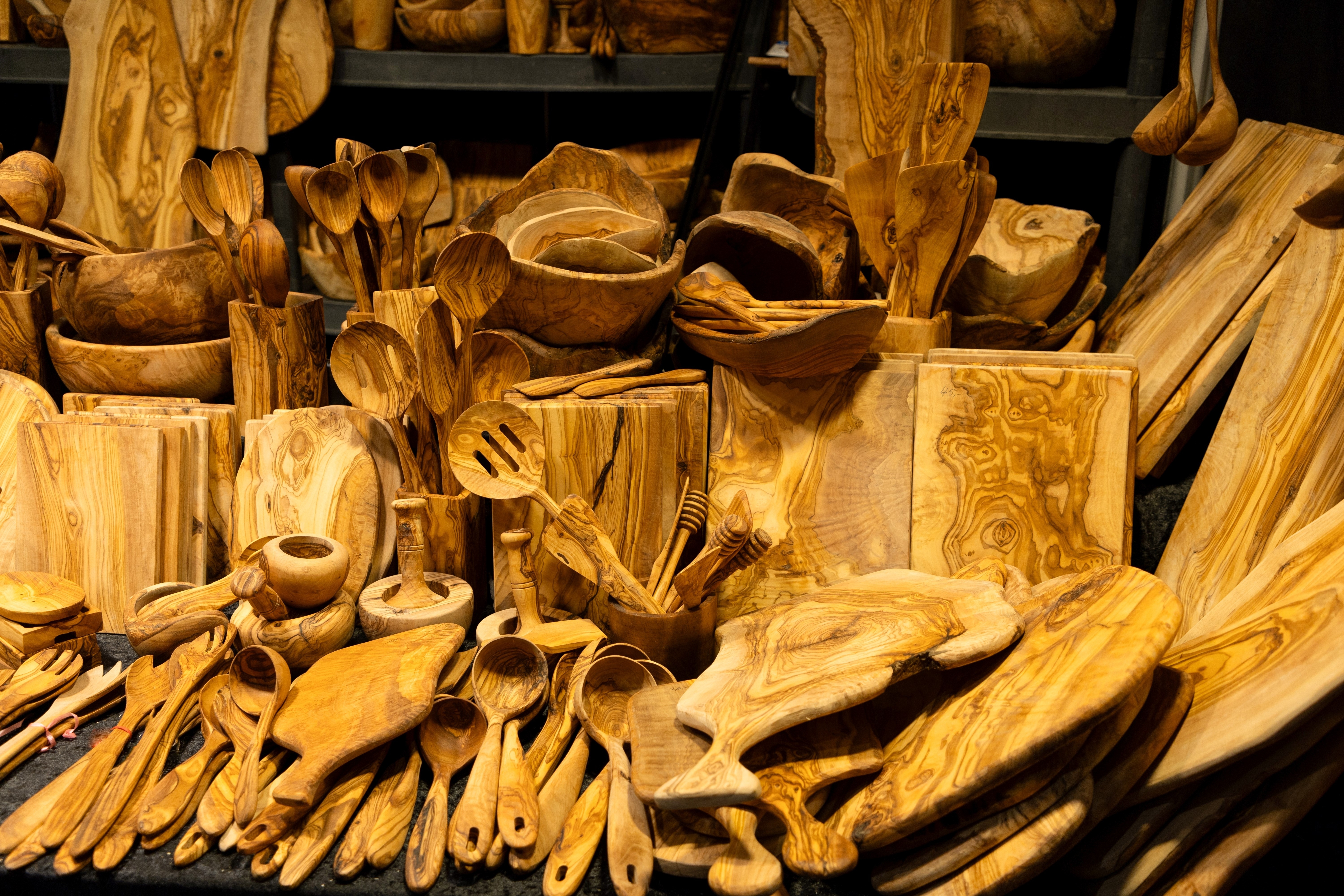 Products made from olive tree, wooden souvenirs on sale. many different household items made from beautiful wood are up for sale