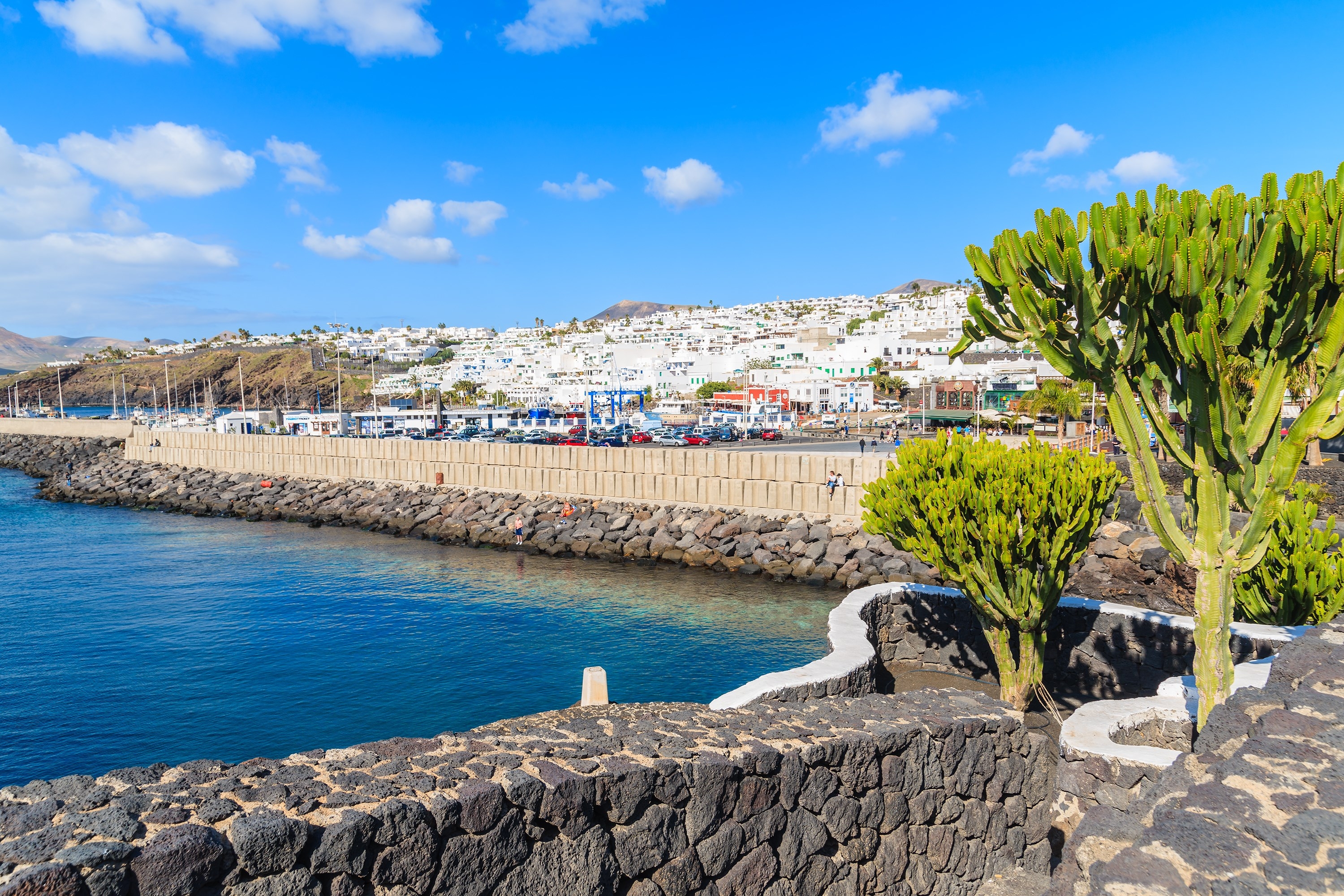 Promenade along ocean coast in Puerto del Carmen holiday town, Lanzarote, Canary Islands, Spain