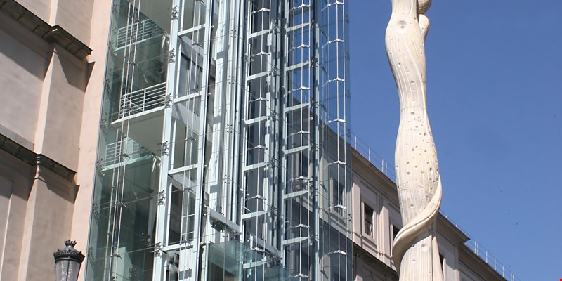 side view of the Reina Sofia Museum in Madrid with Miro statue