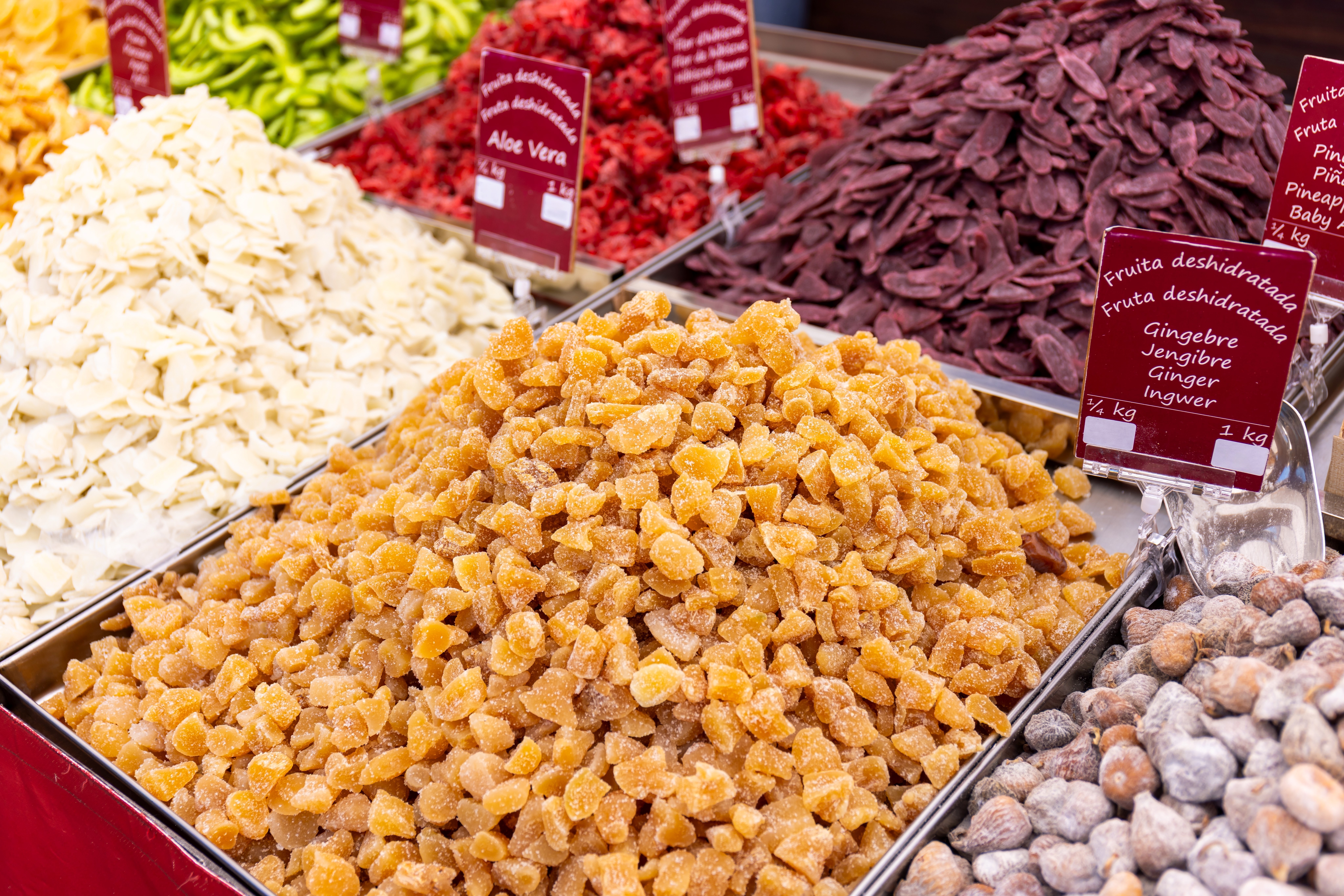 Selection of dried fruits like ginger, aloe vera and other offered at a market stall