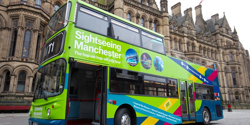 lime-green Hop-on Hop-off bus in Manchester