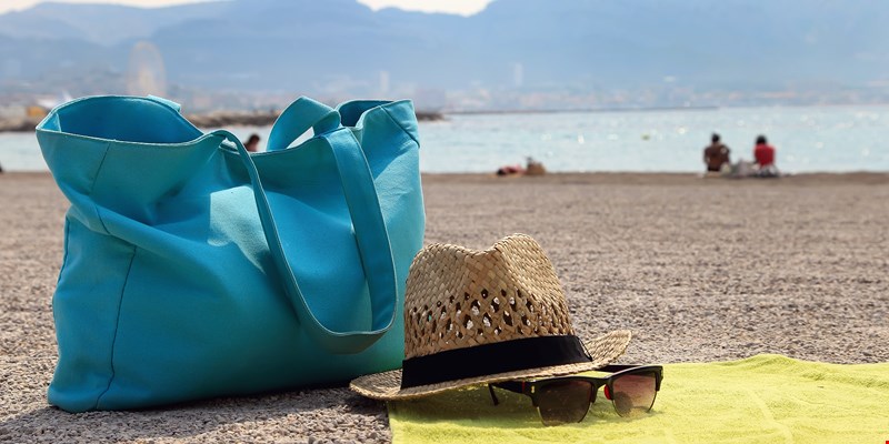 Hat, beach bag and the glasses on the rug