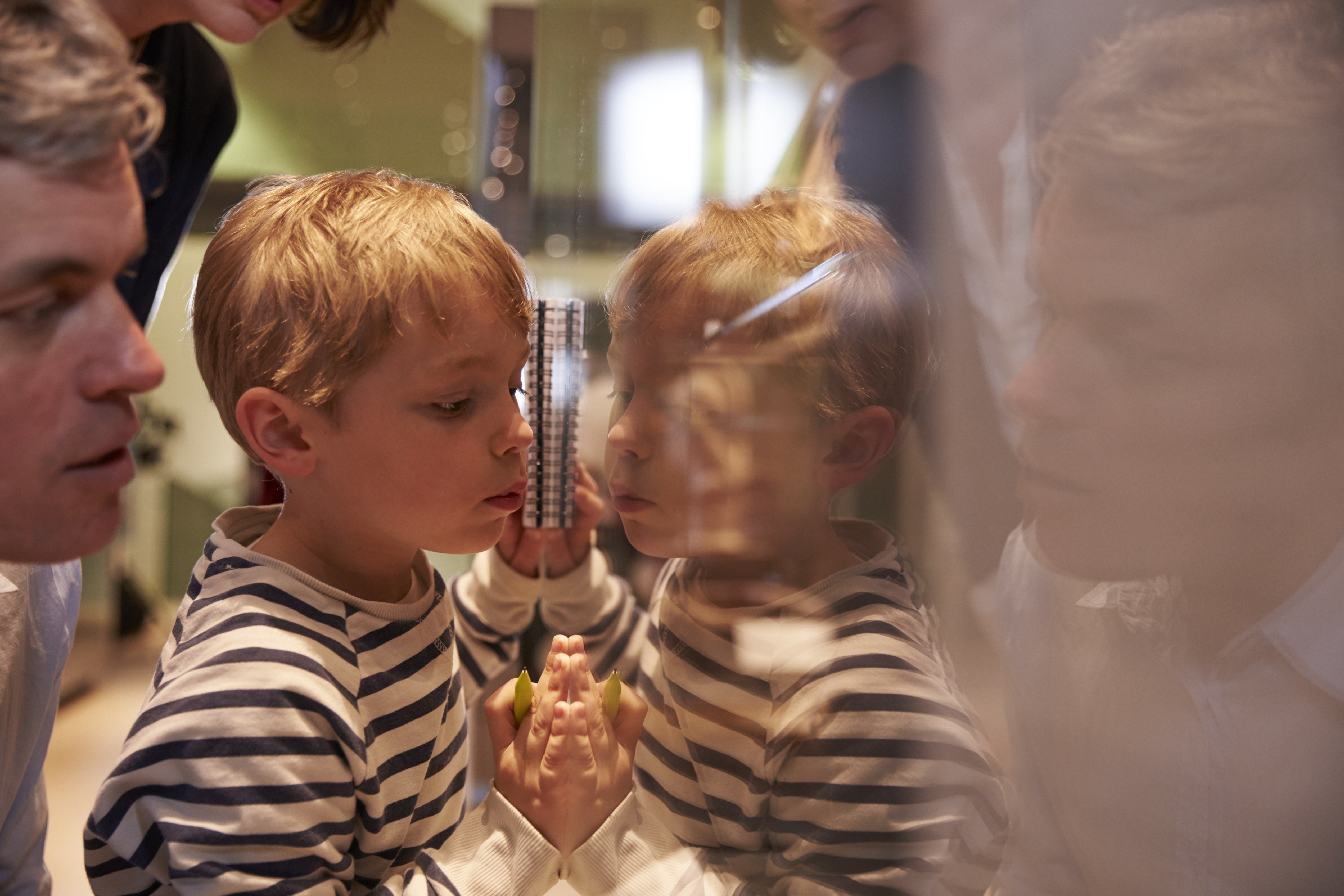 amily Looking At Artifacts In Glass Case On Trip To Museum