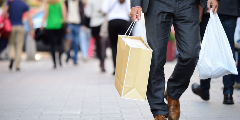 Man with shopping bags in the street
