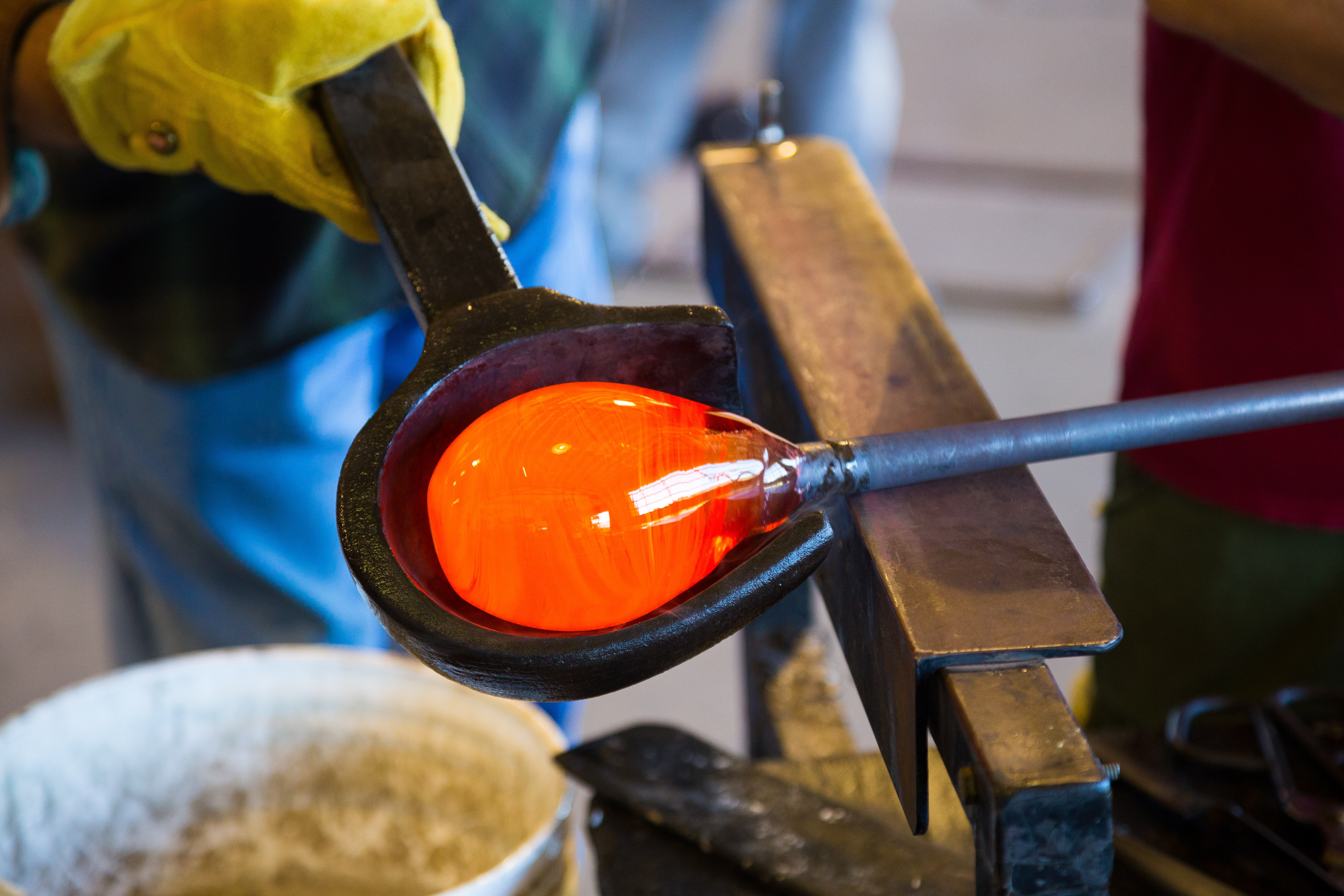 Shaping glass in a studio for glass making.