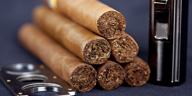 Cuban top cigars with lighter and cutter
