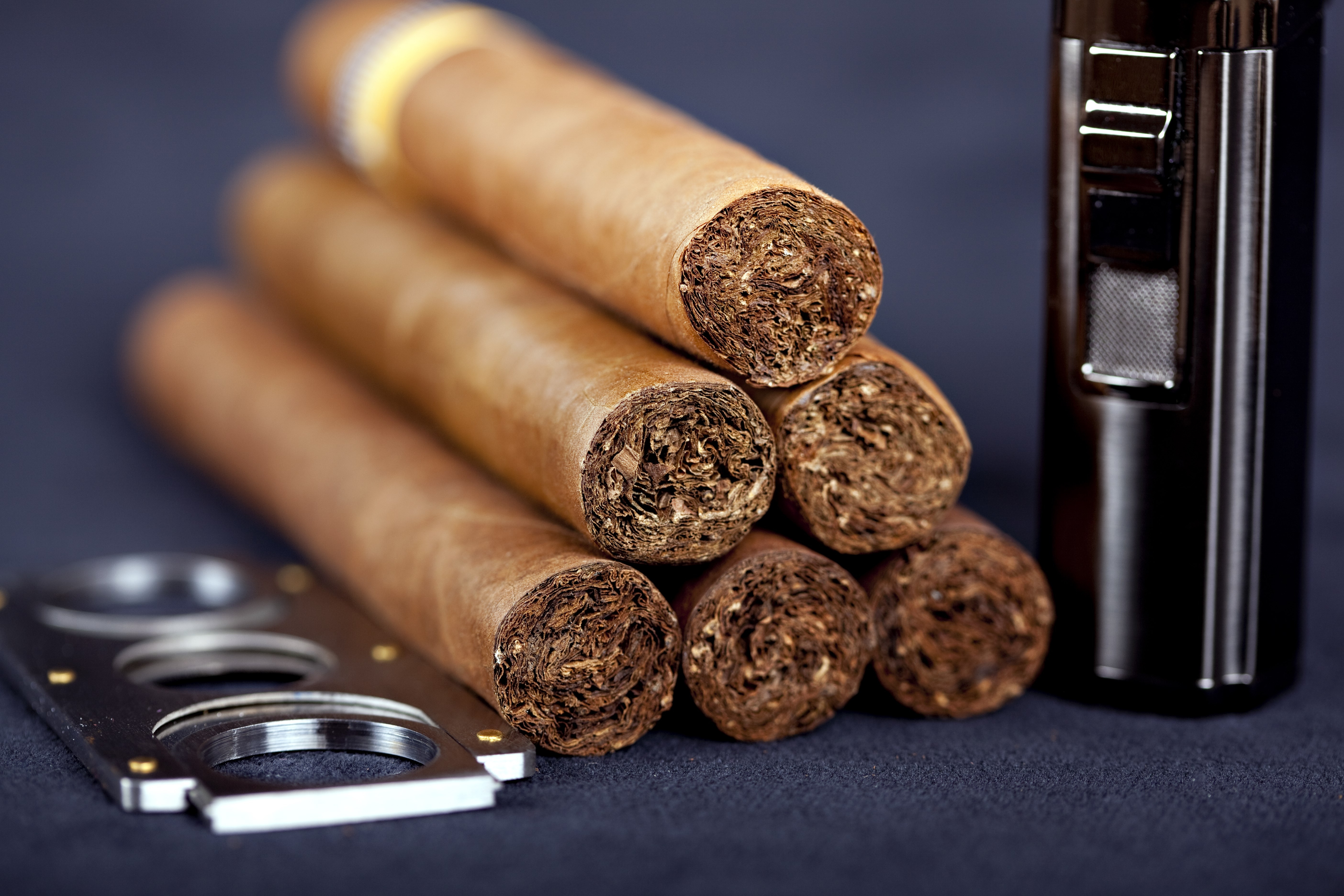 Cuban top cigars with lighter and cutter