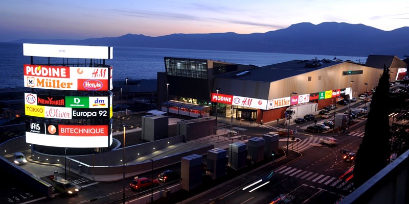 Image of different colored clothes in the modern shopping centre