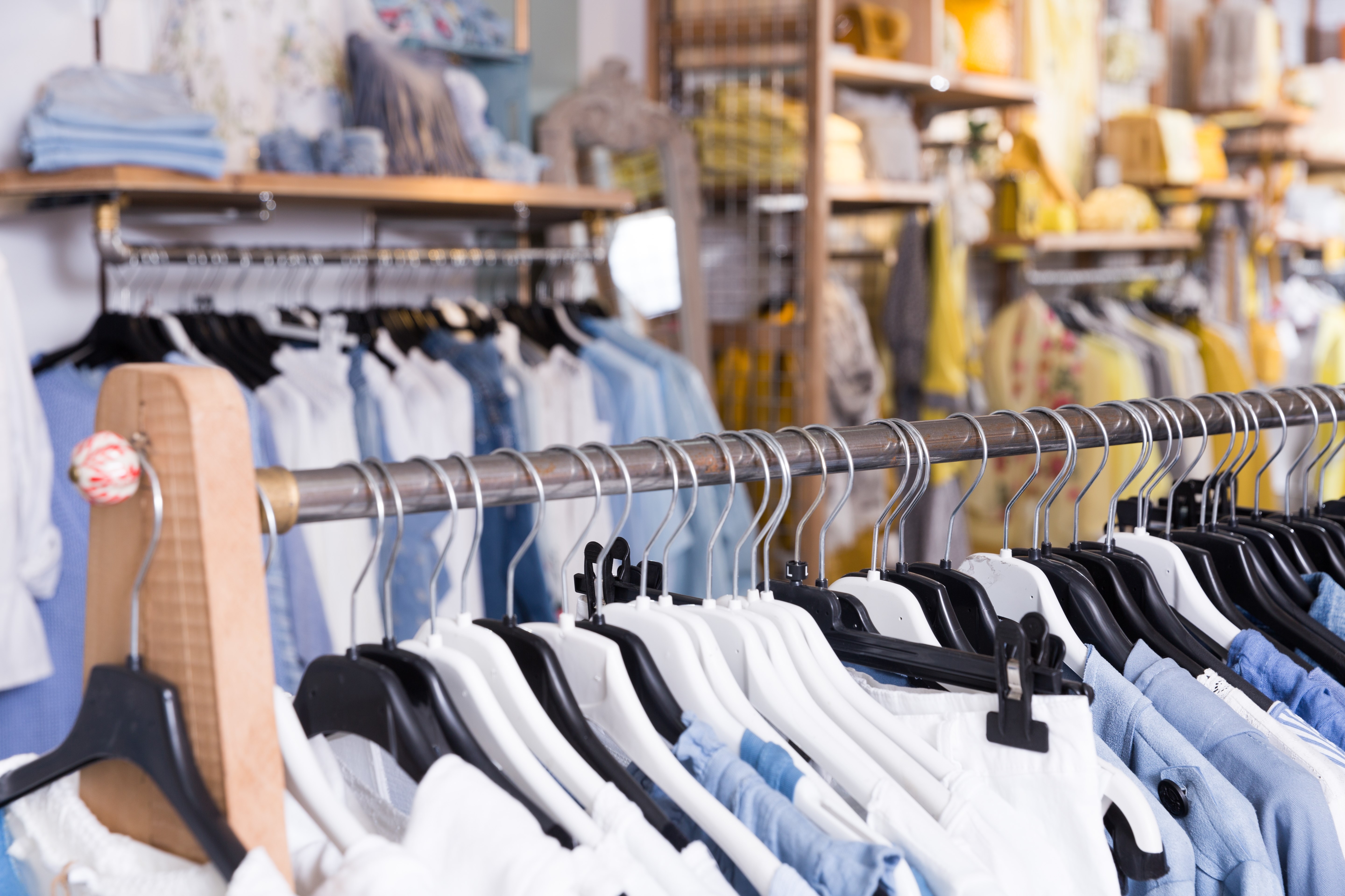 Image of different colored clothes in the modern shopping centre