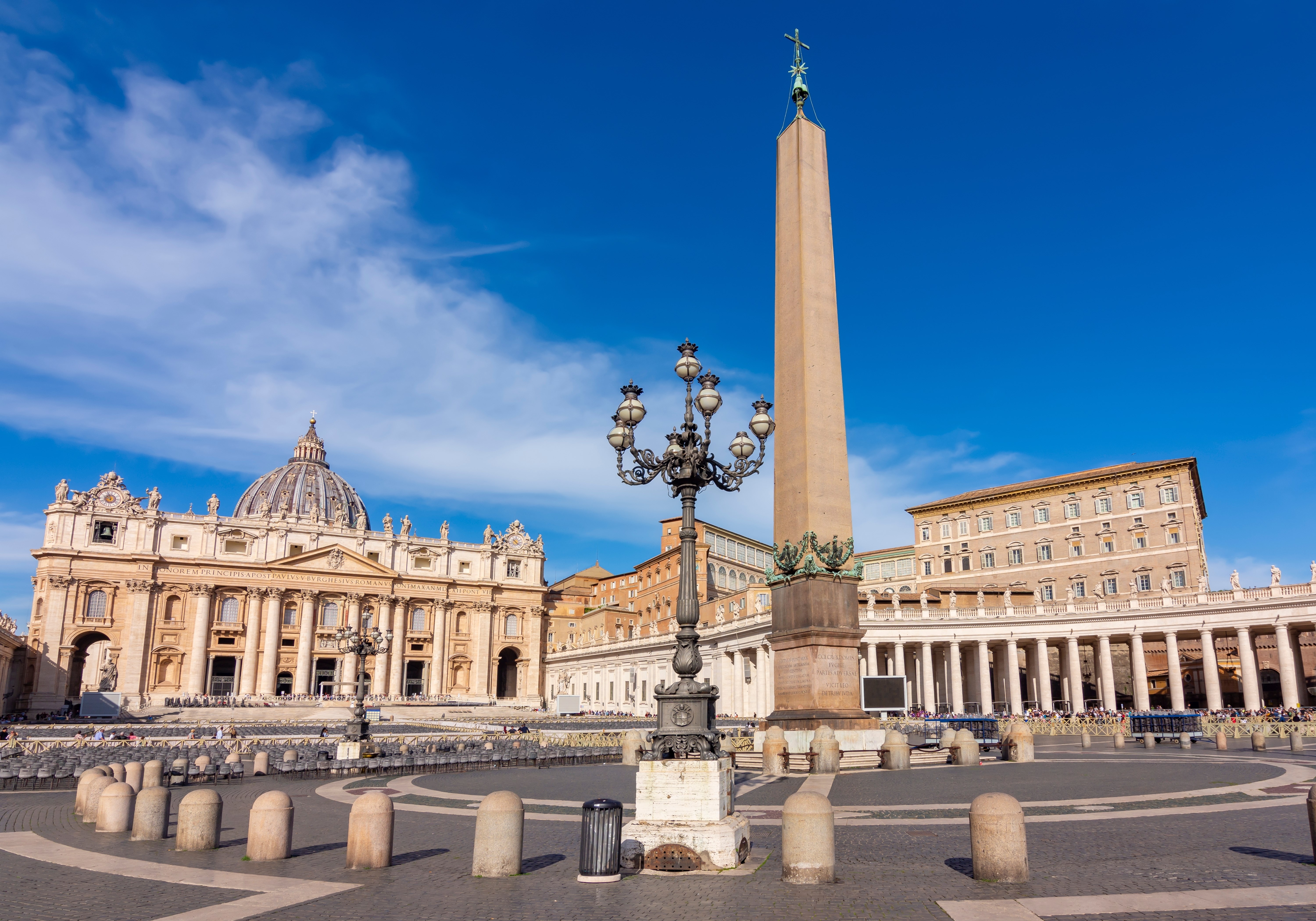 St Peter's basilica and Egyptian obelisk on St Peter's square in Vatican, Rome, Italy (translation "In honor of prince of Apostles; Paul V Borghese, Pope, in year 1612 and 7th year of pontificate)