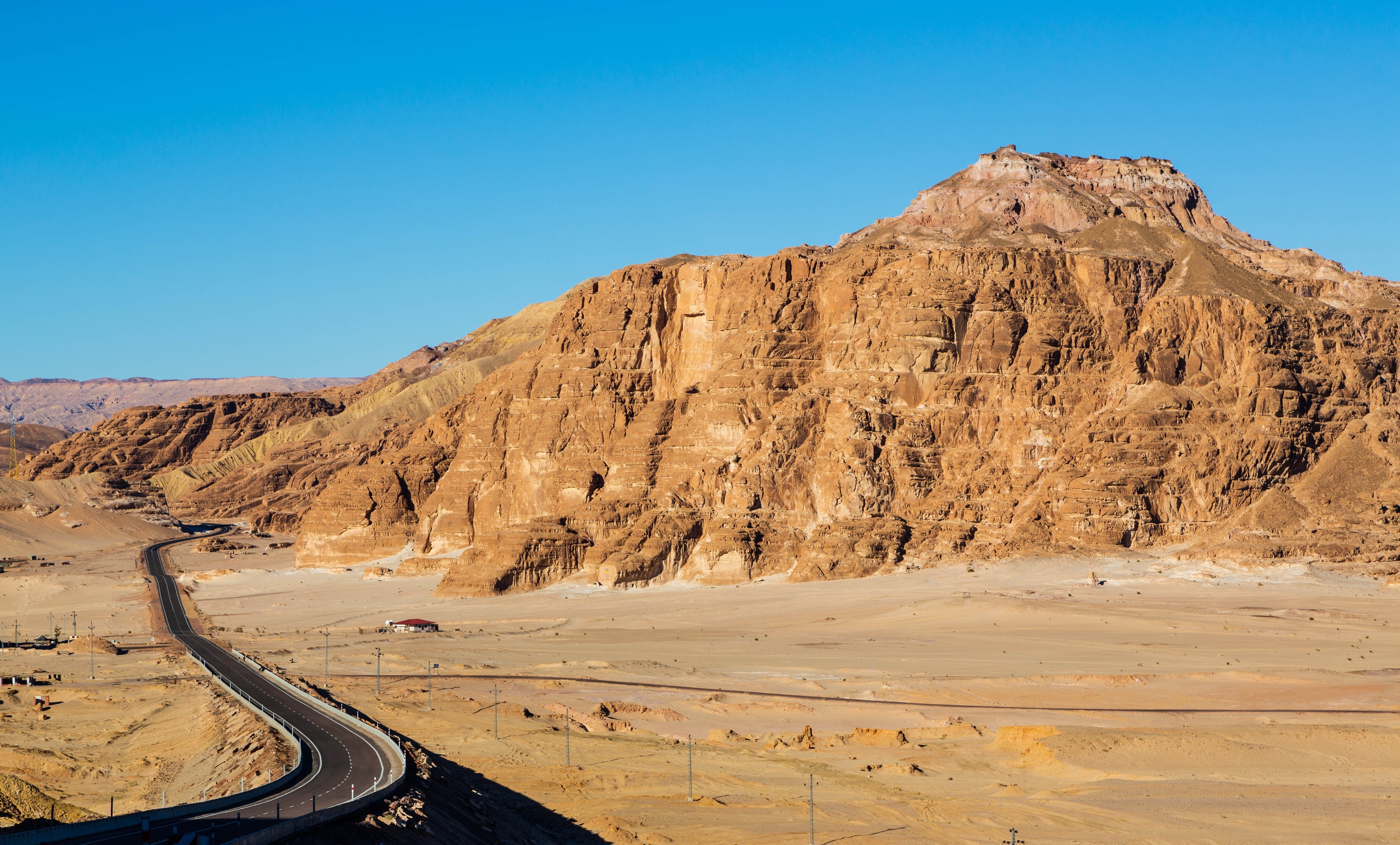 Winding road in the valley in Sinai mountains, beautiful landscape of the mountains, orange sand of Sinai. South Sinai, Sinai peninsula, Egypt