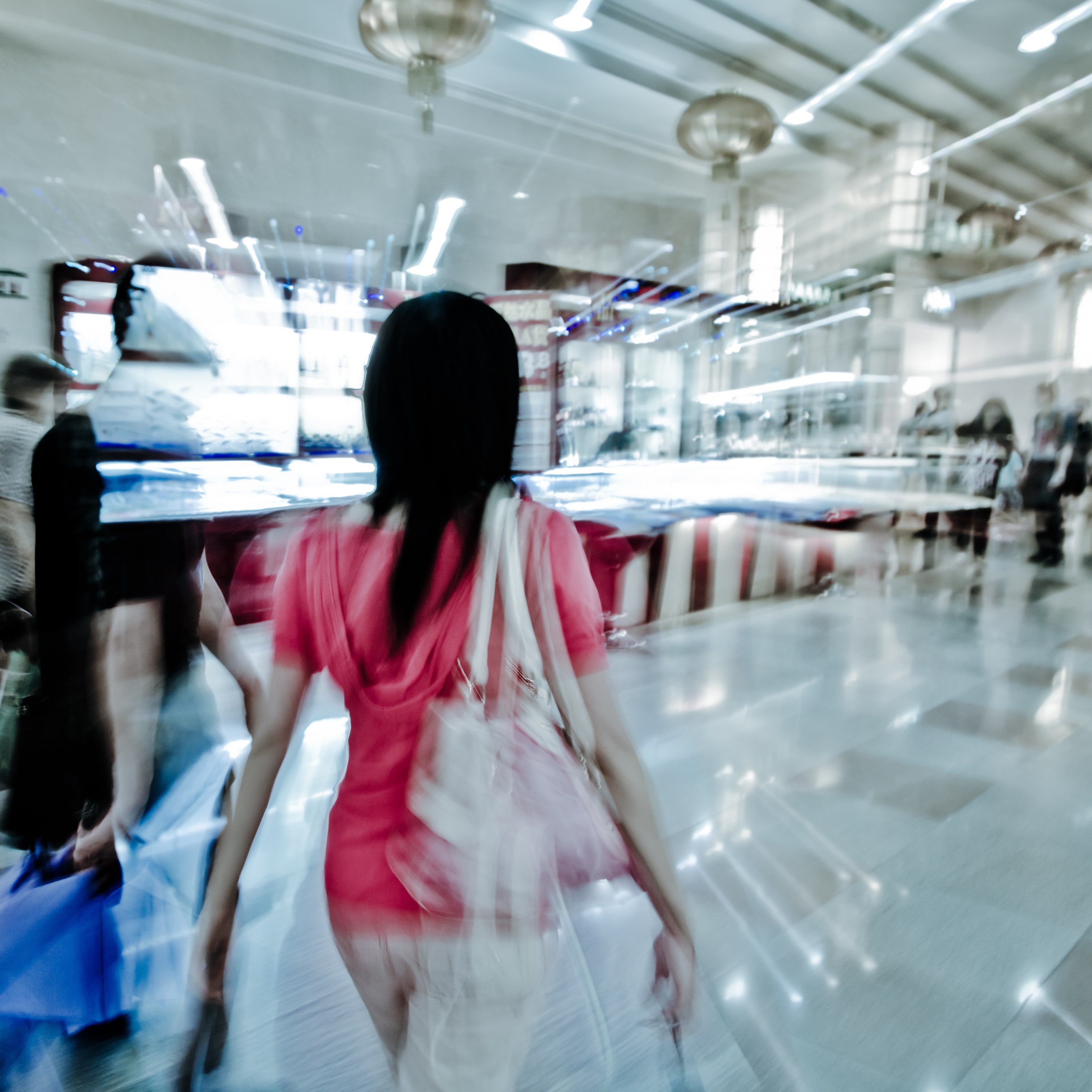 Walking shopper people on the street, blur motion