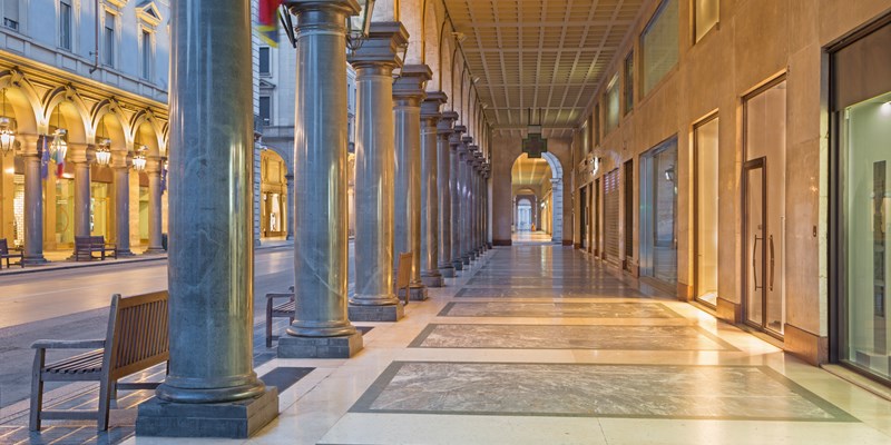 Turin - The porticoes of of Via roma street at dusk.