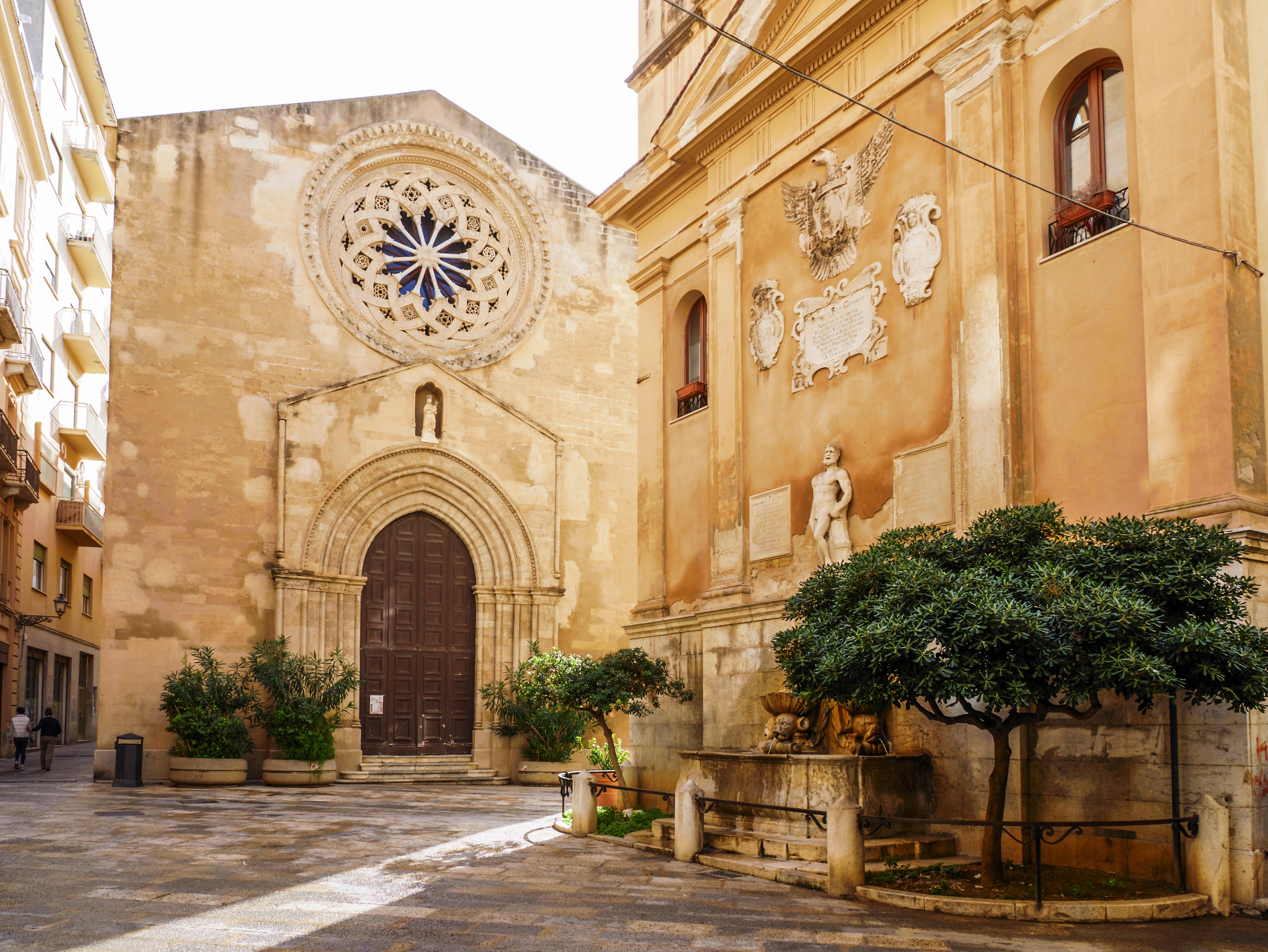 The St. Augustine Church and the Fountain of Saturn in Trapani, Sicily, Italy.