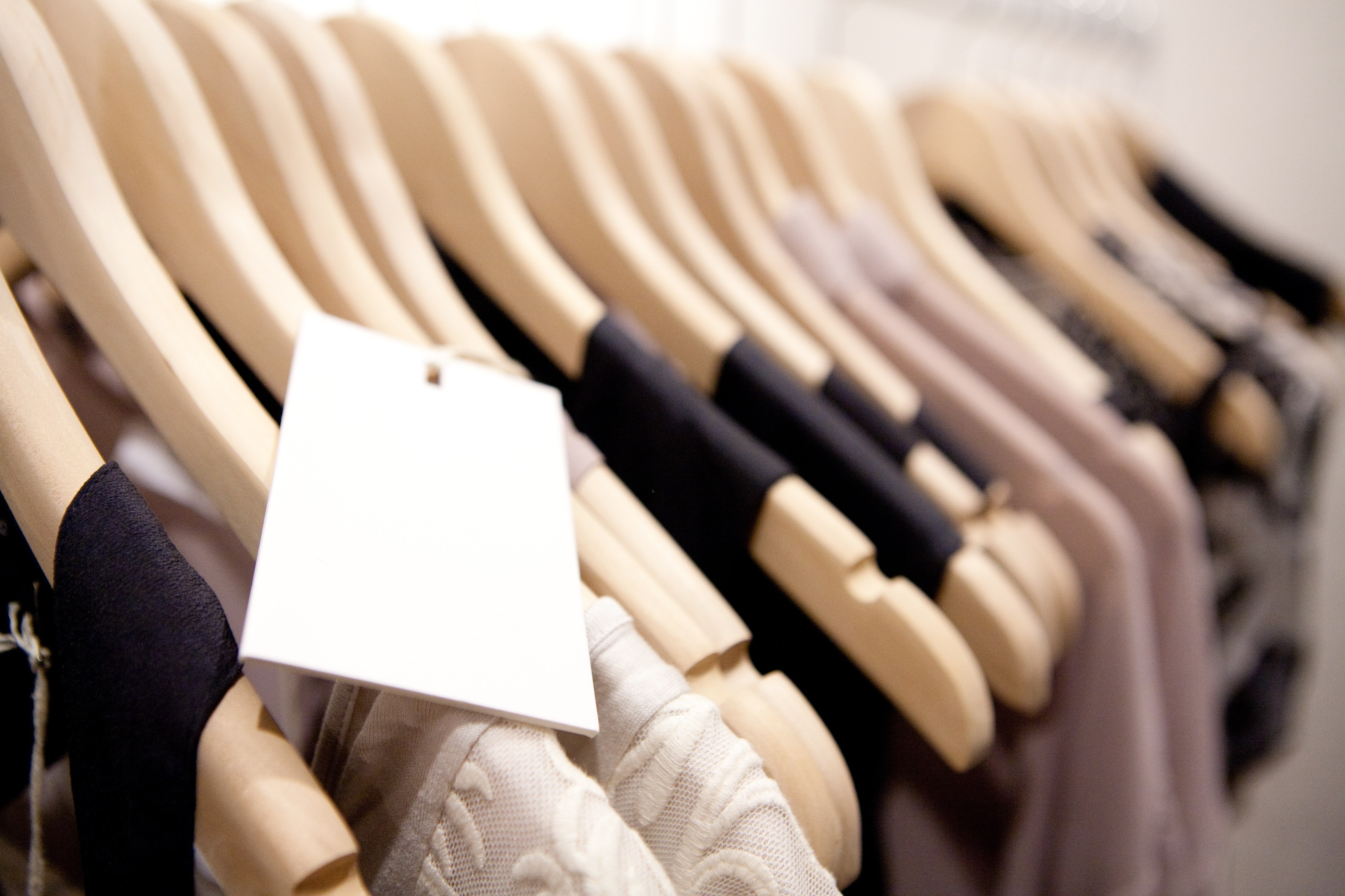 Clothes hang on a shelf in a designer clothes store in Melbourne, Australia