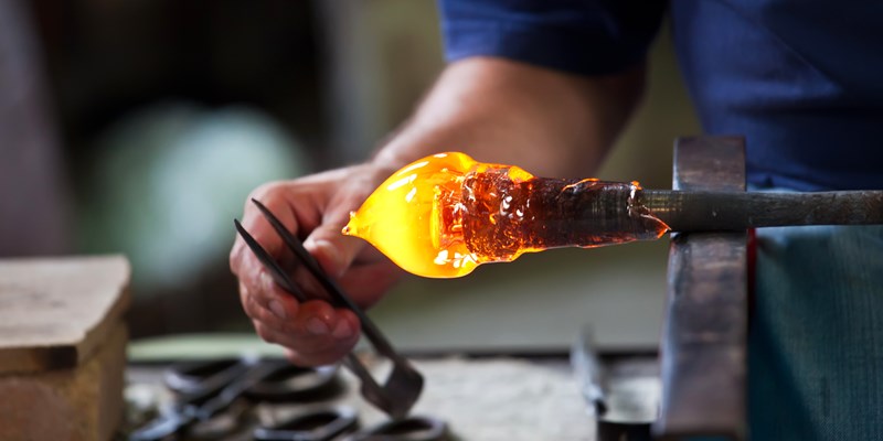 Glass blower forming beautiful piece of glass, Murano, Venice, Italy