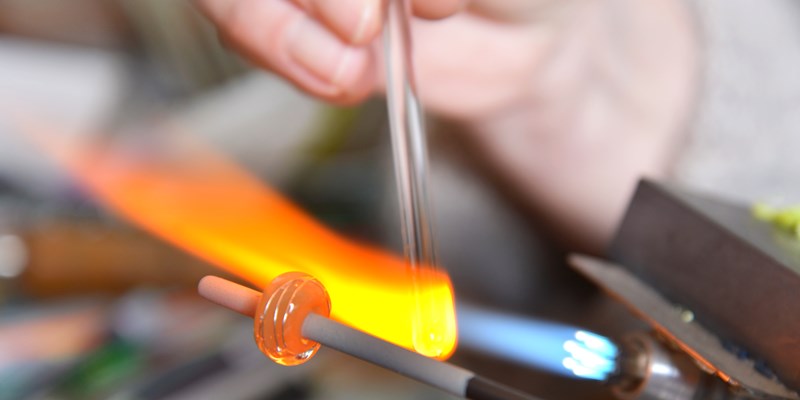 Glass Artist in her workshop.