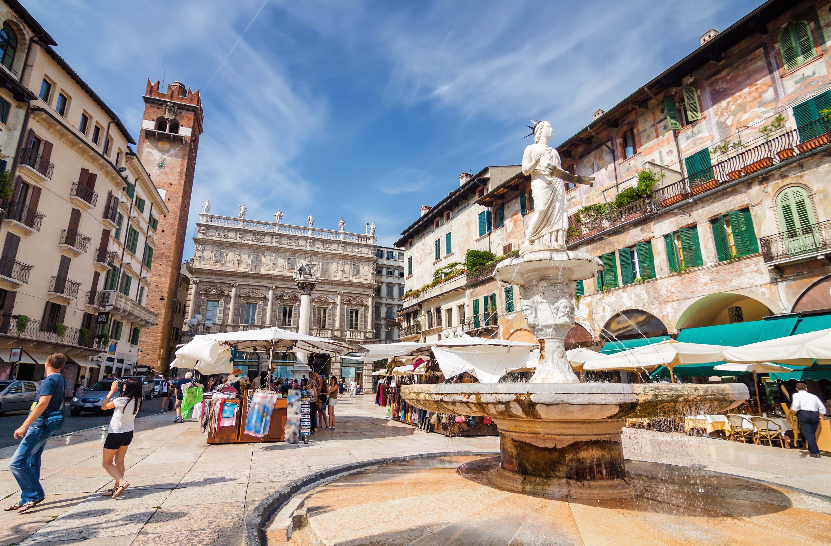 Sunny view of the Piazza delle Erbe, palazzo Maffei and Gardello tower at historical center of Verona, Veneto region, Italy.