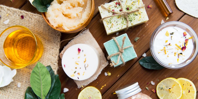 close up of body care cosmetic products on wood