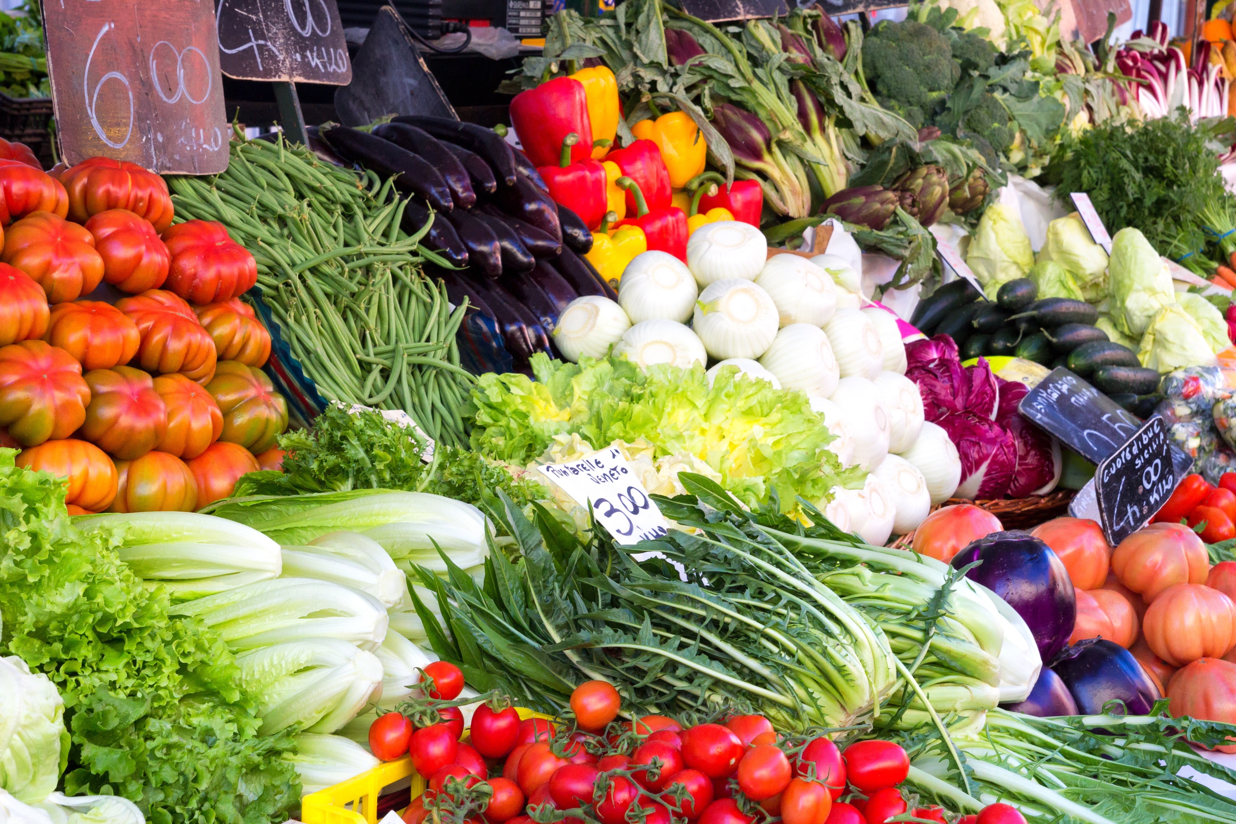Colourful fresh fruit and vegetables stall arrangement